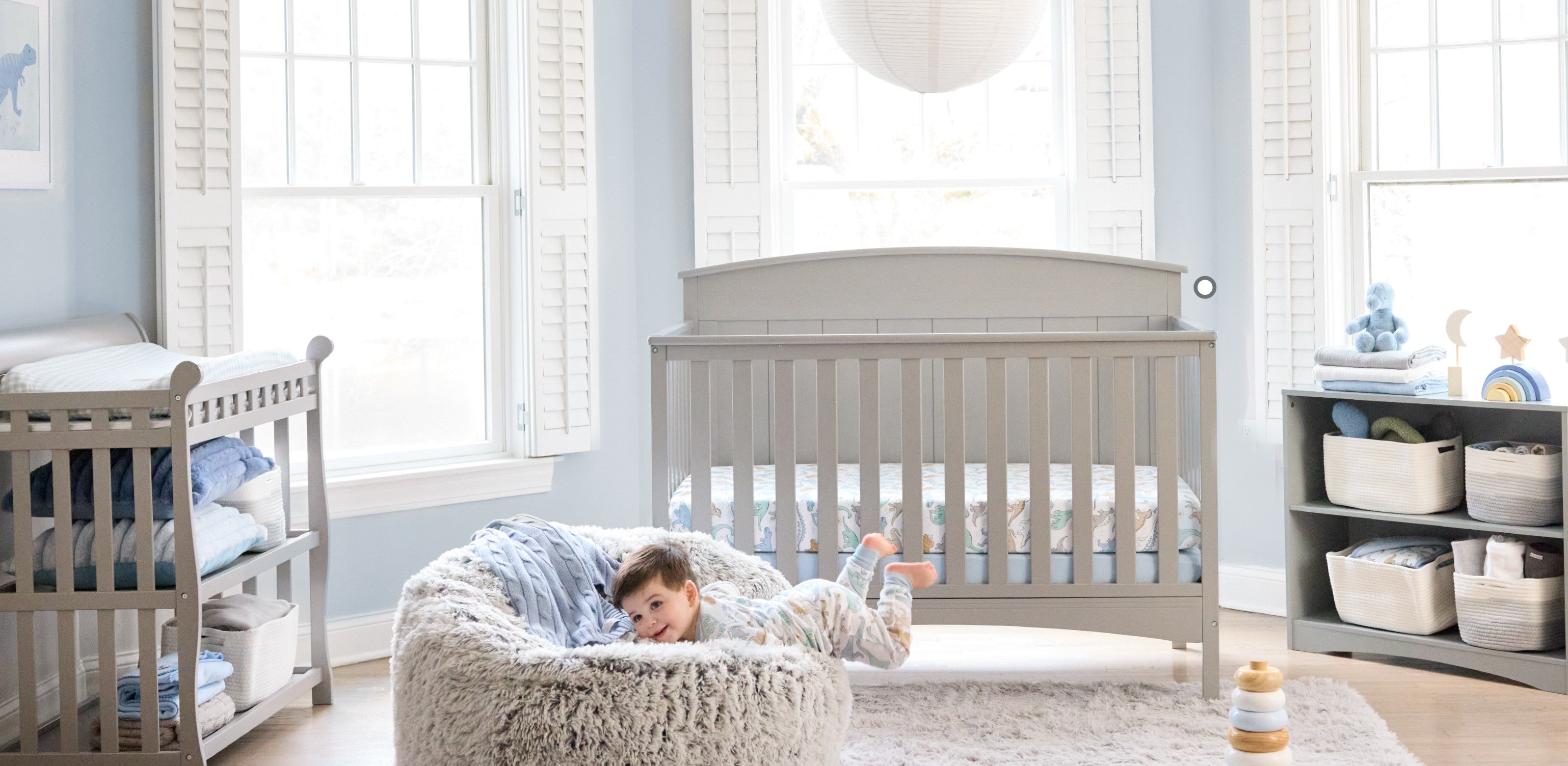 Rawr-Some nursery collection — organic baby bedding, swaddles, and decor with dinosaur print from Butterblu