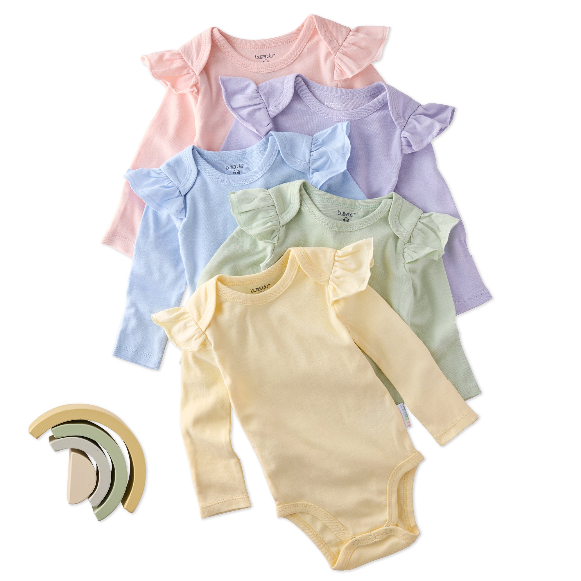 Set of pastel-colored baby bodysuits with a wooden toy on a white background