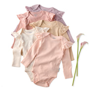 Set of baby bodysuits in various colors with ruffled sleeves on a white background.