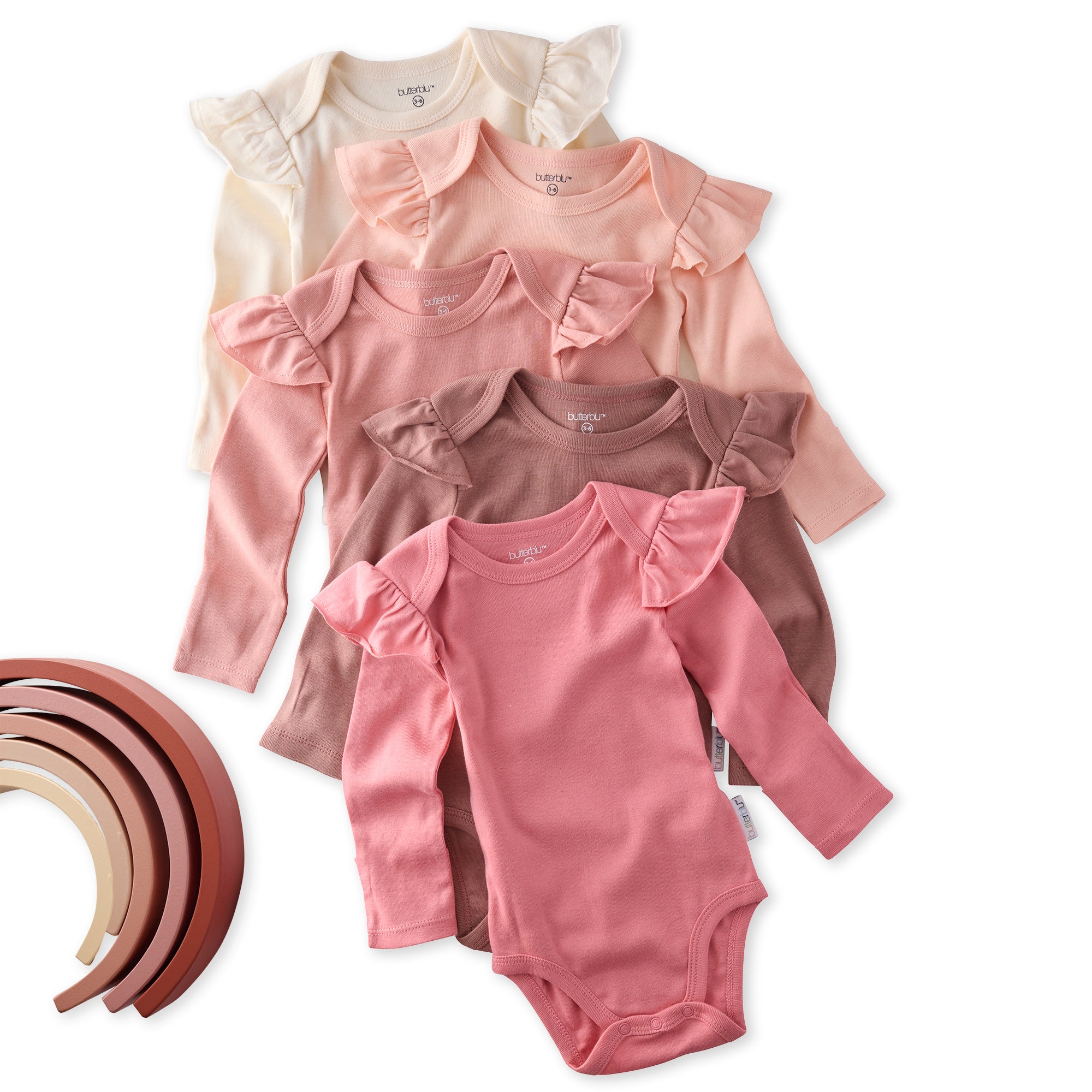 Set of baby bodysuits in various pink shades with ruffled shoulders on a white background.