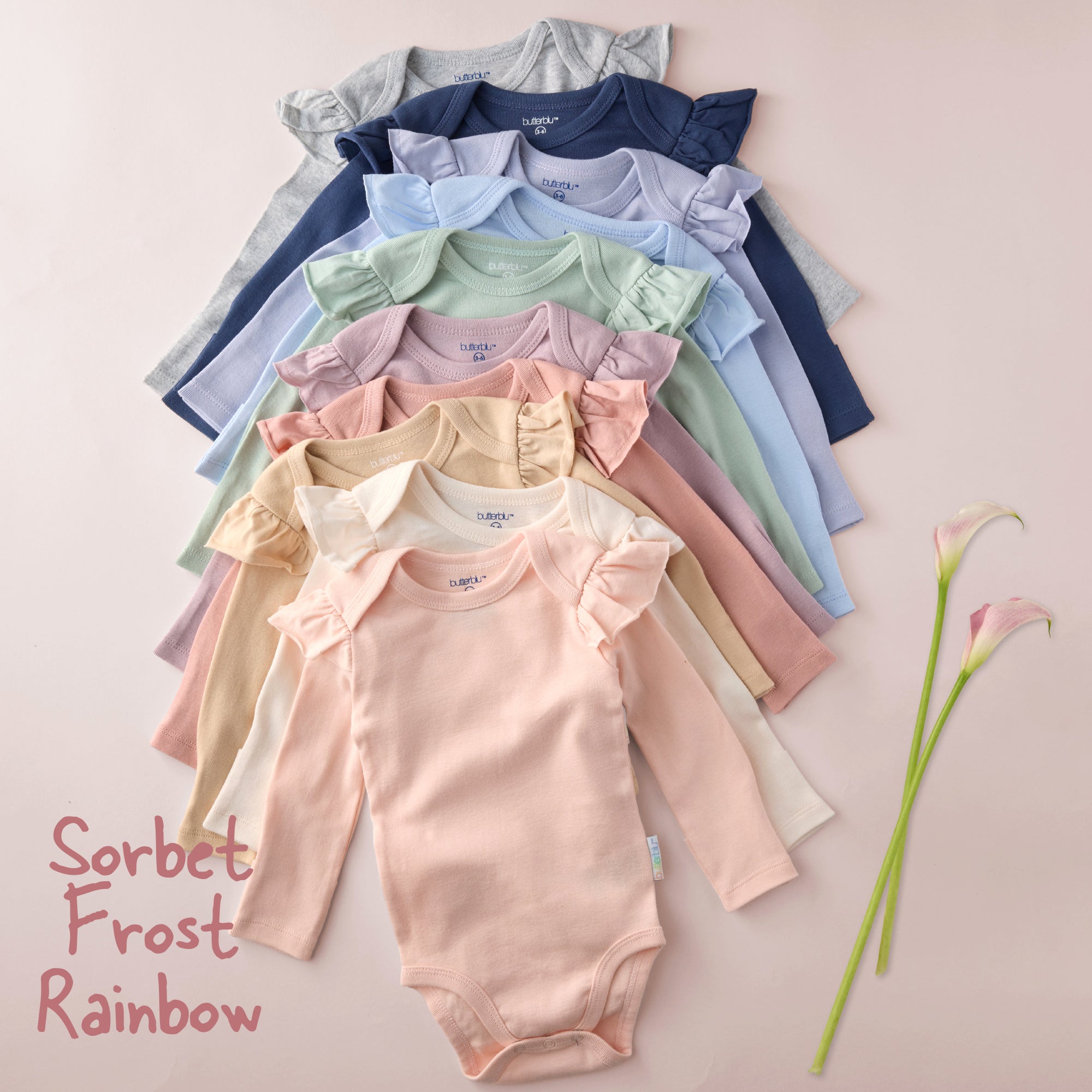 Stack of colorful baby rompers on a light background with 'Sorbet Frost Rainbow' text.
