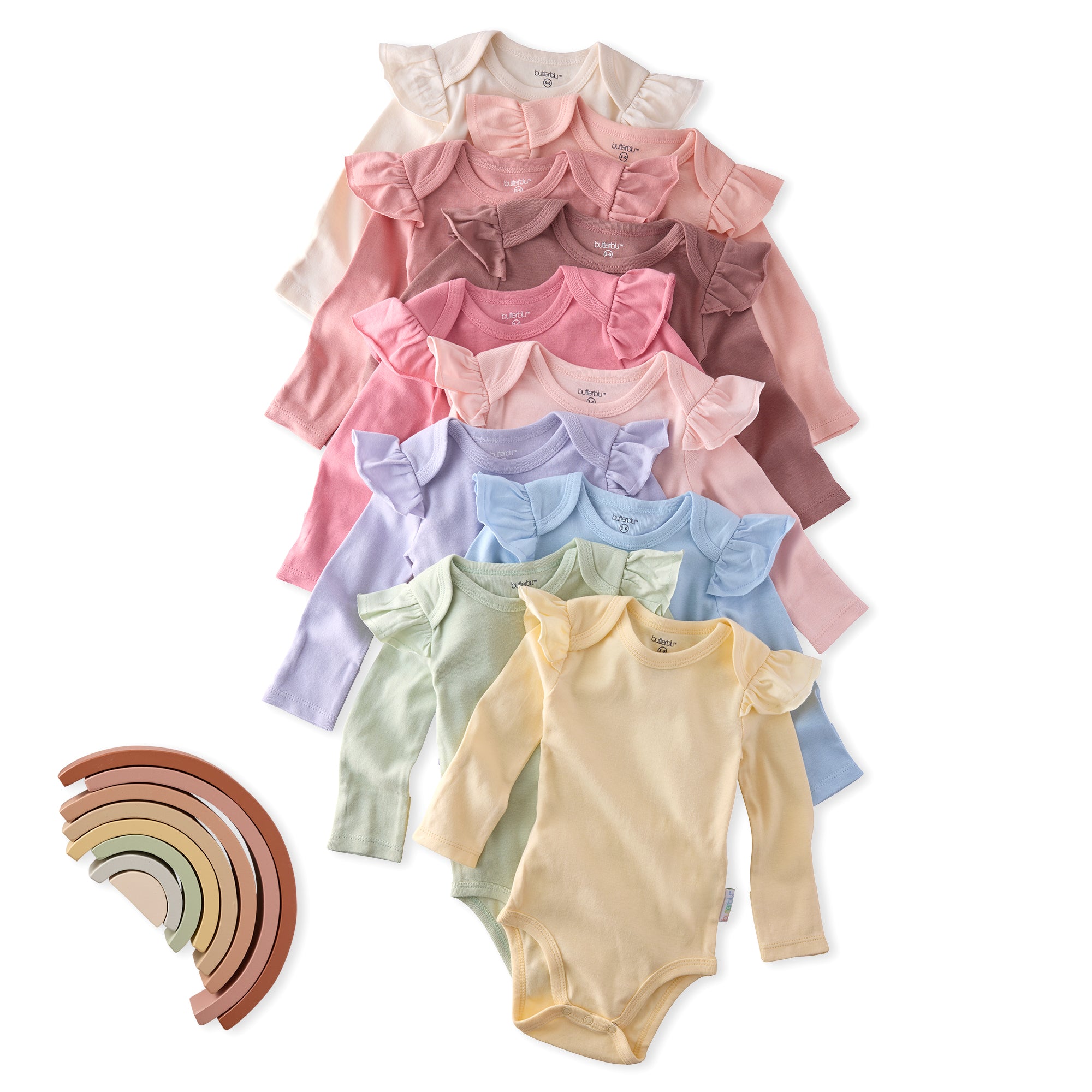 Stack of colorful baby bodysuits with a rainbow-shaped object on a white background