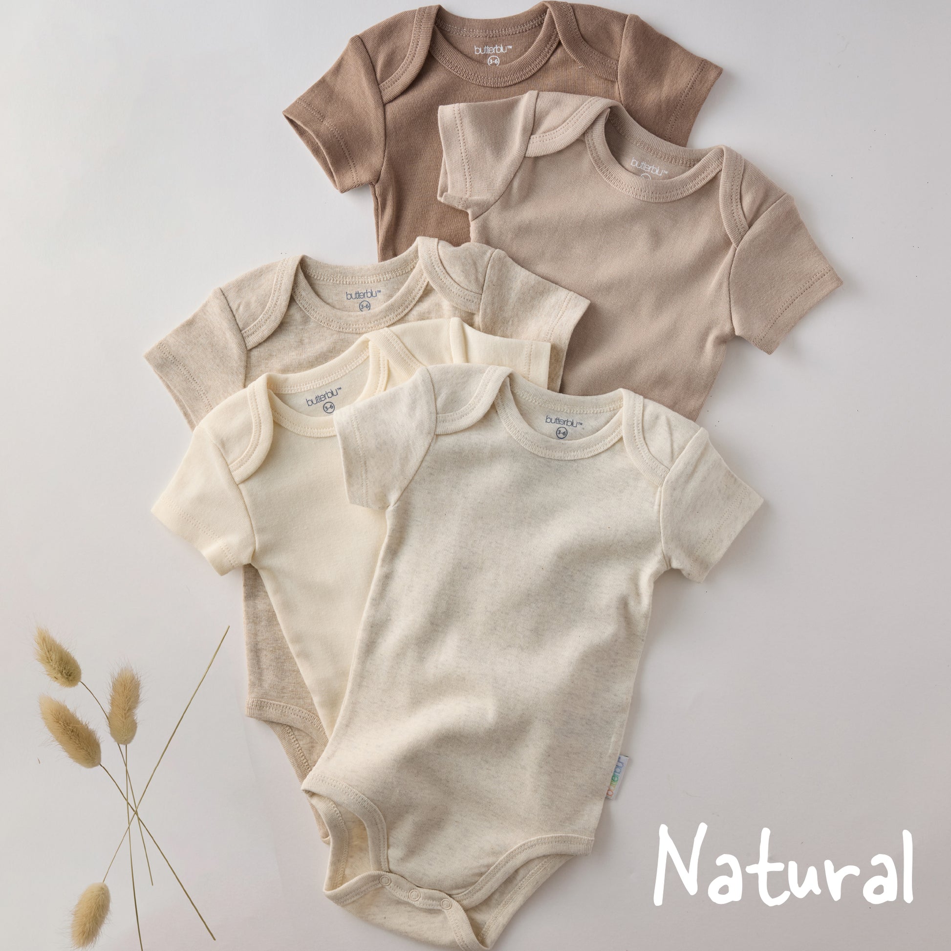 Set of baby bodysuits in beige and brown on a light gray background with 'Natural' text.