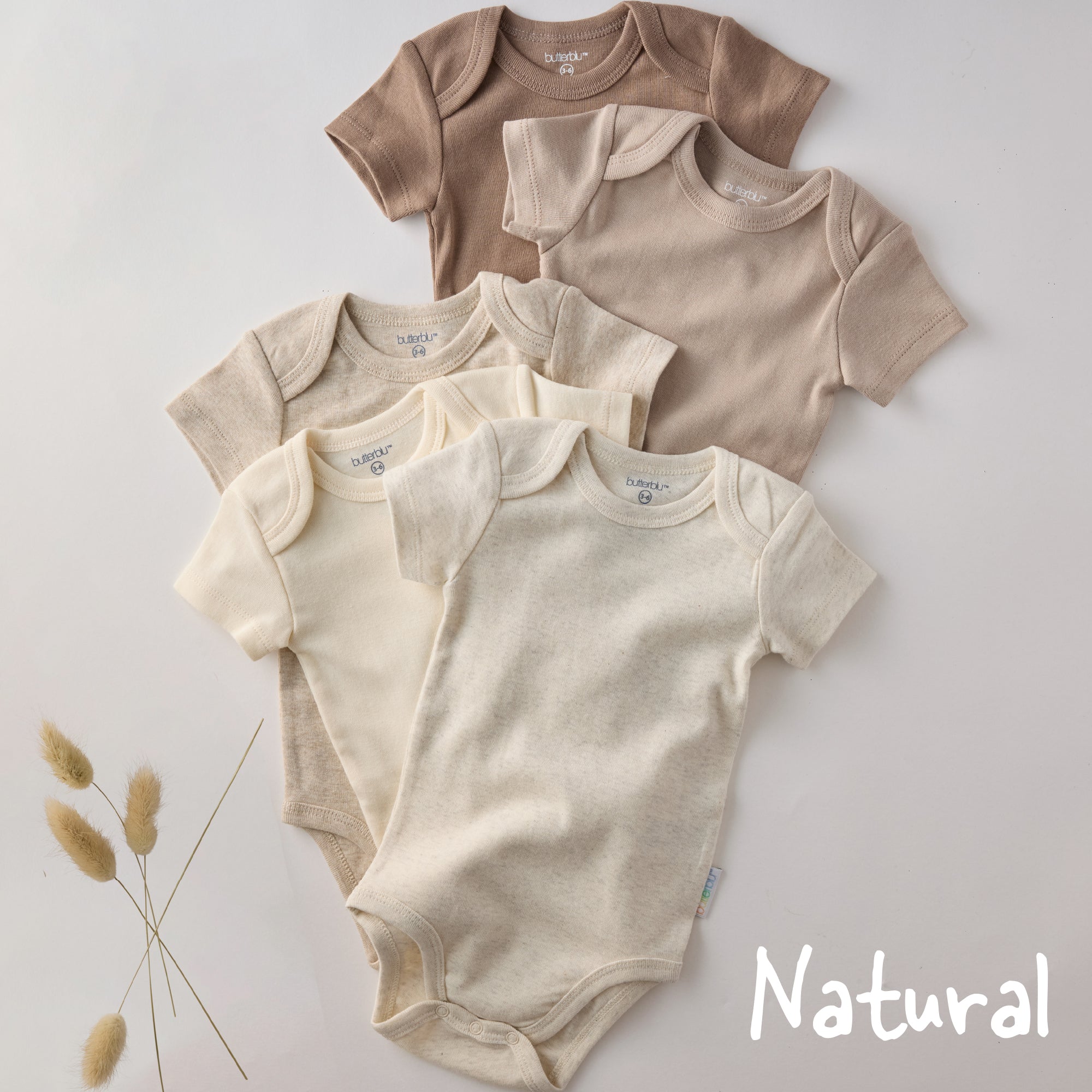 Set of baby bodysuits in beige and brown on a light gray background with 'Natural' text.