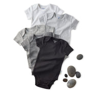Set of black and gray baby bodysuits with stones on a white background