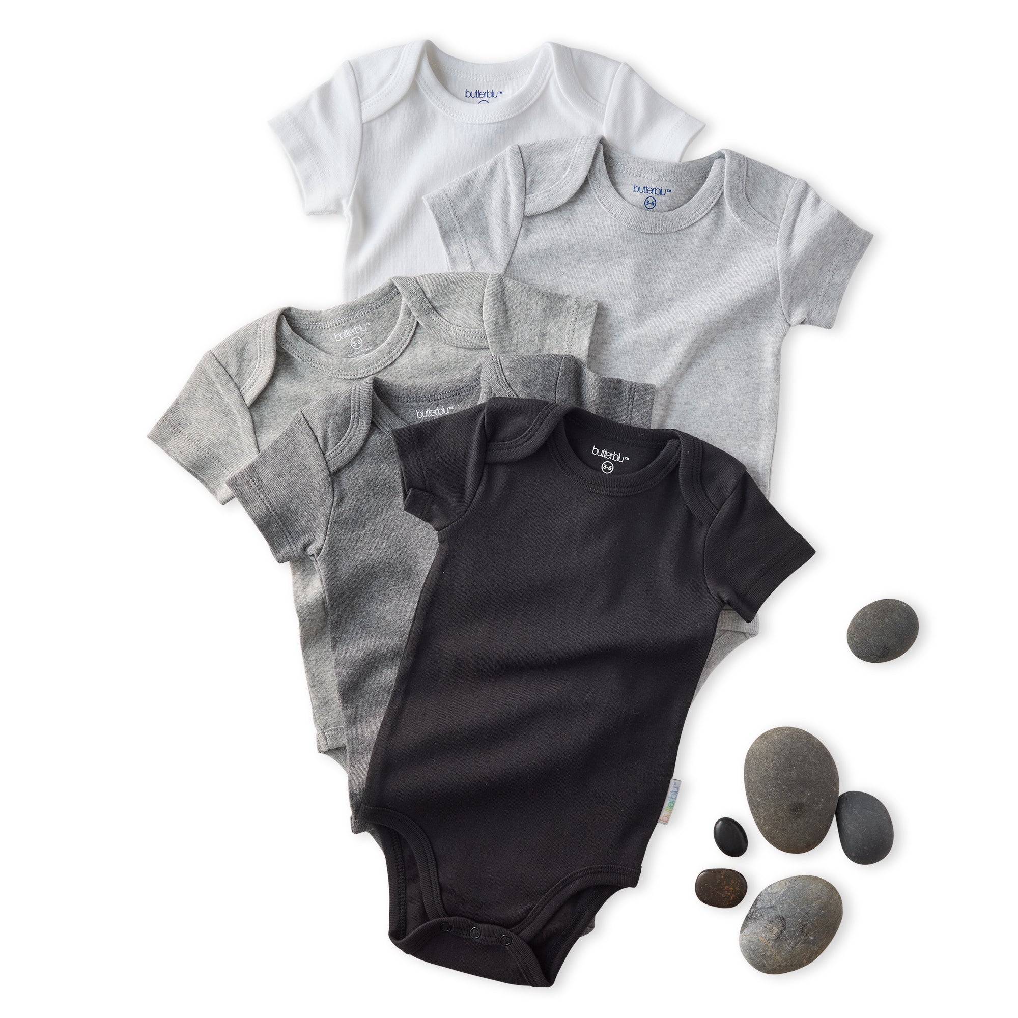 Set of black and gray baby bodysuits with stones on a white background