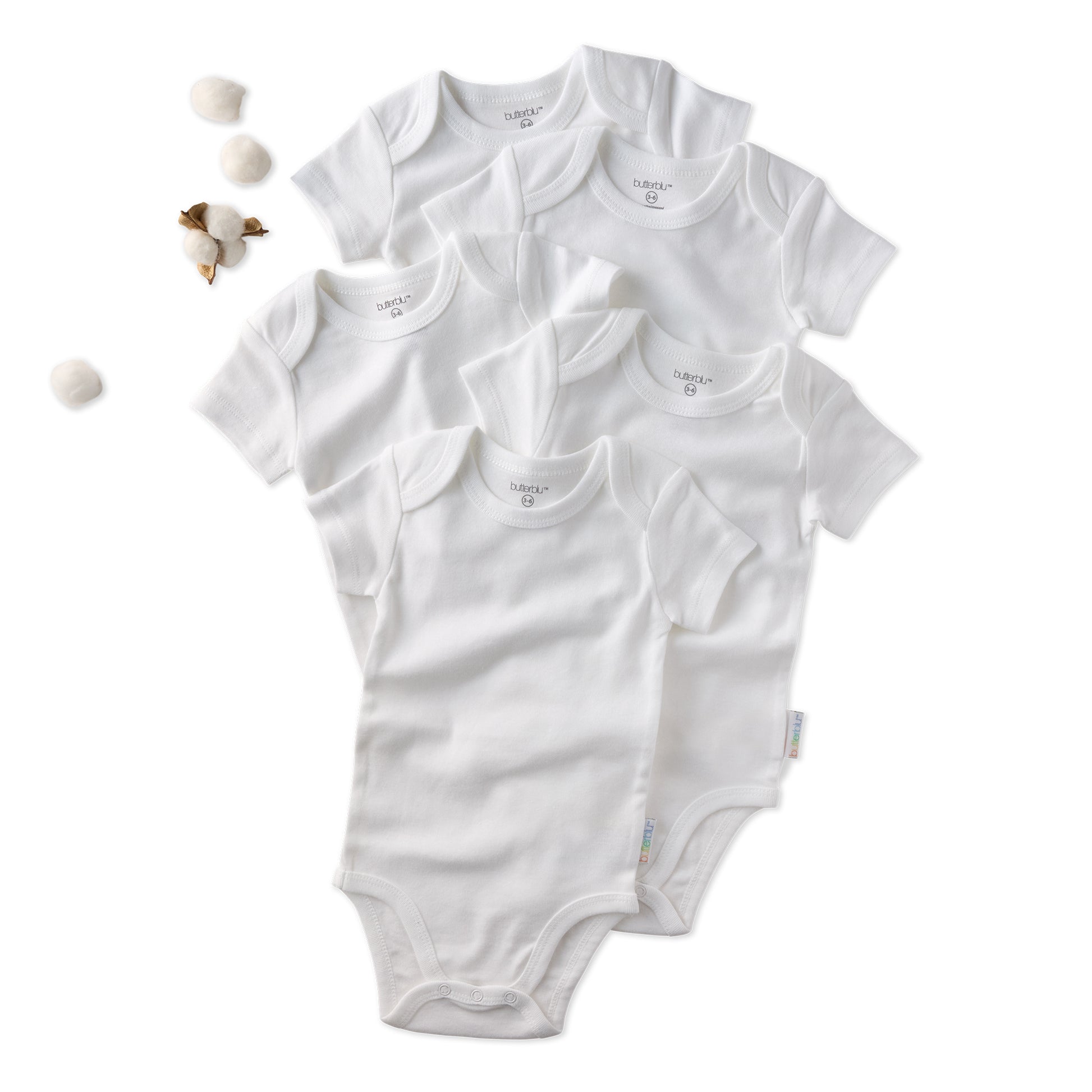 Set of white baby bodysuits on a white background