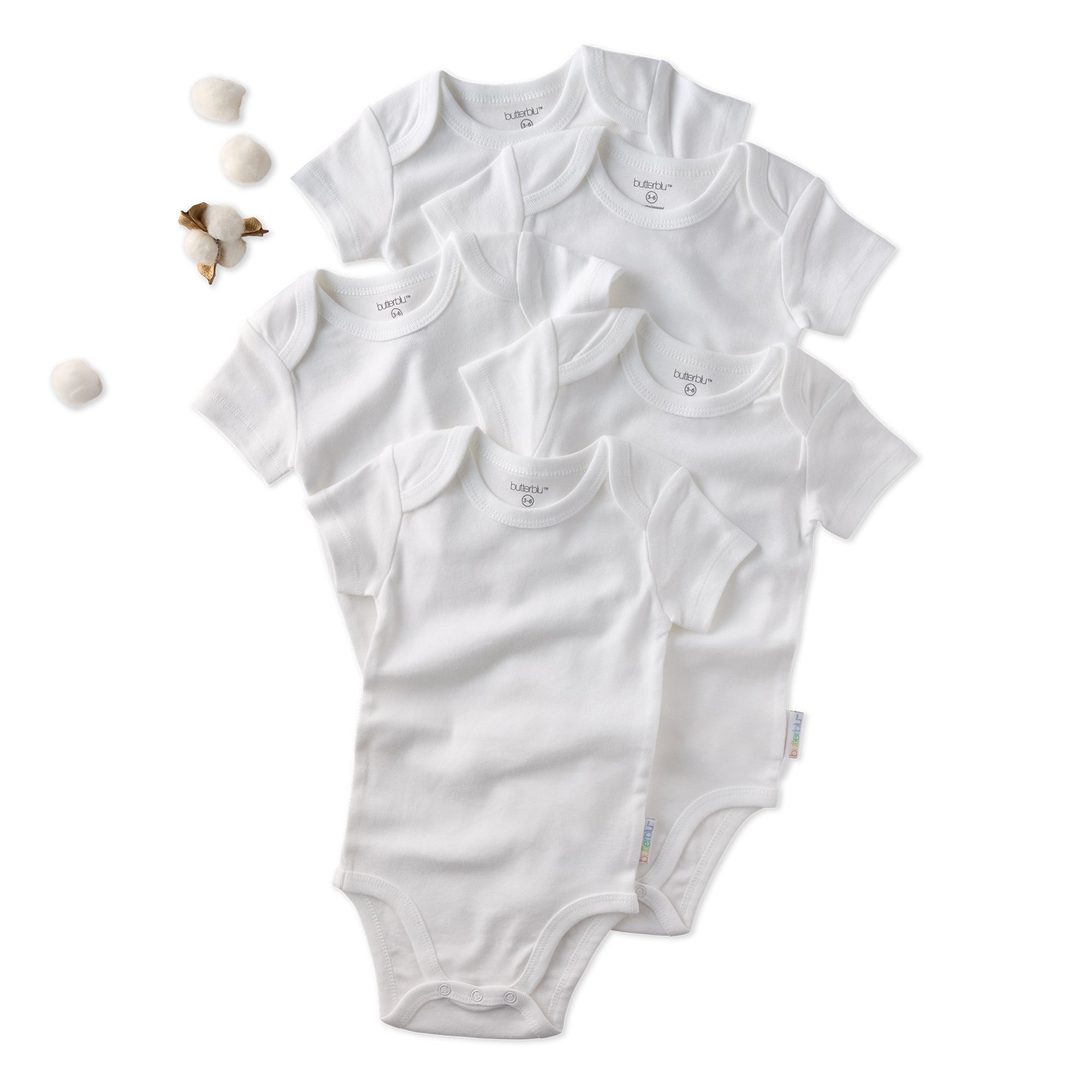 Set of white baby bodysuits on a white background