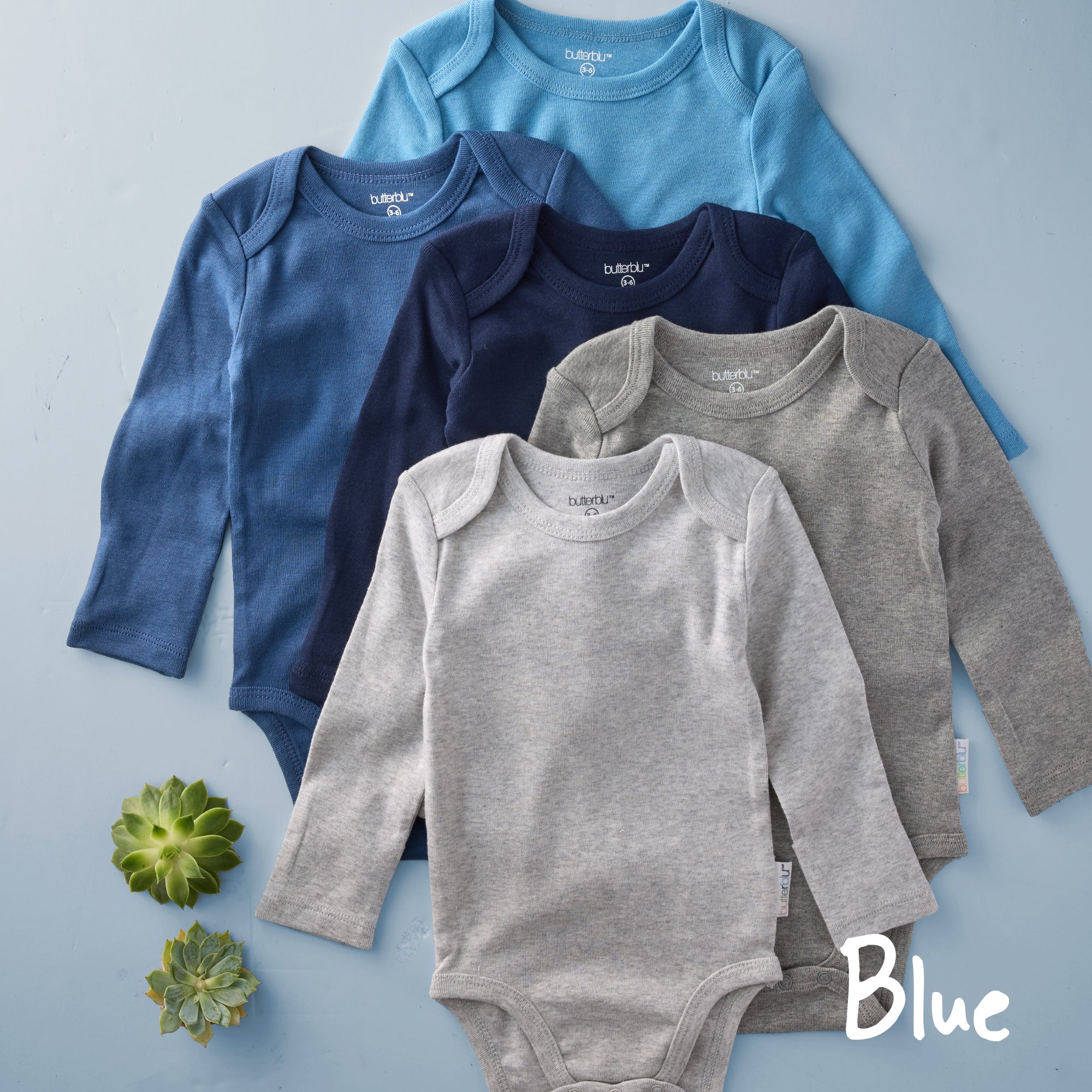 Five baby onesies in blue, gray, and navy on a light blue background with 'Blue' text.