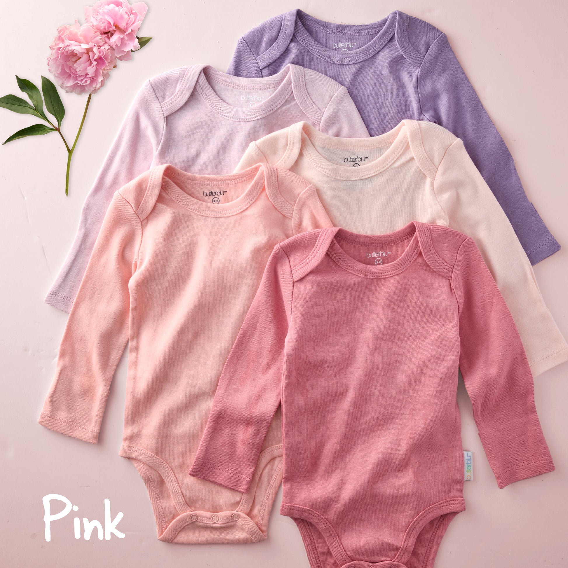 Four baby bodysuits in pink and purple on a light background with 'Pink' text.