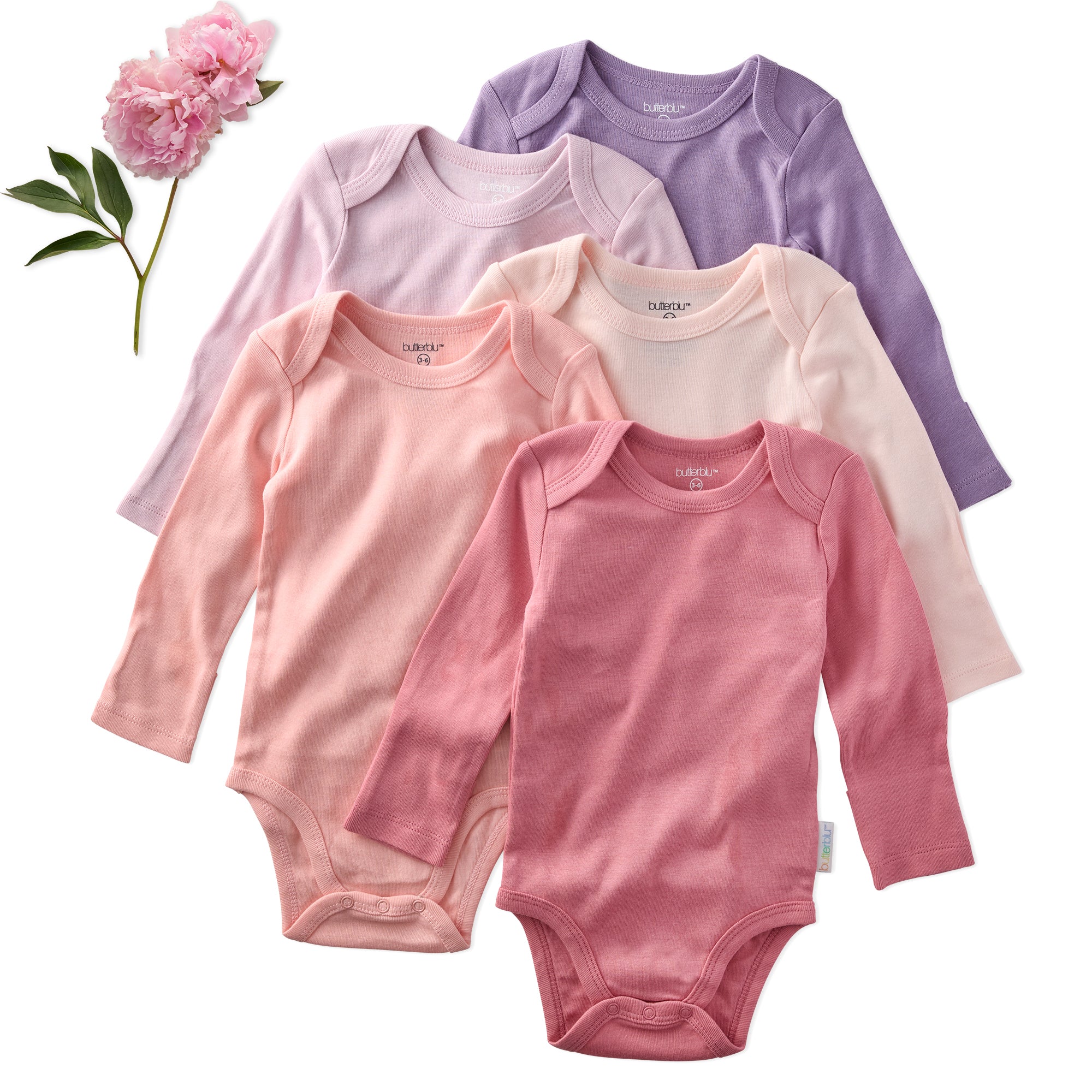 Five baby bodysuits in pink and purple on a white background with a flower.