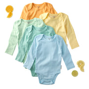 Set of five colorful baby bodysuits on a white background with orange and lemon slices.