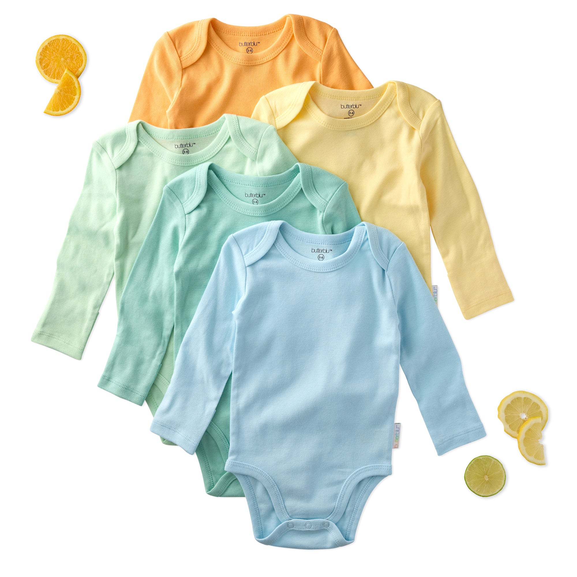 Set of five colorful baby bodysuits on a white background with orange and lemon slices.