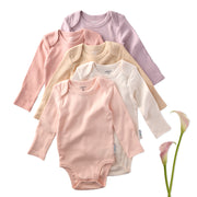 Set of five baby bodysuits in pink, beige, and white on a white background.