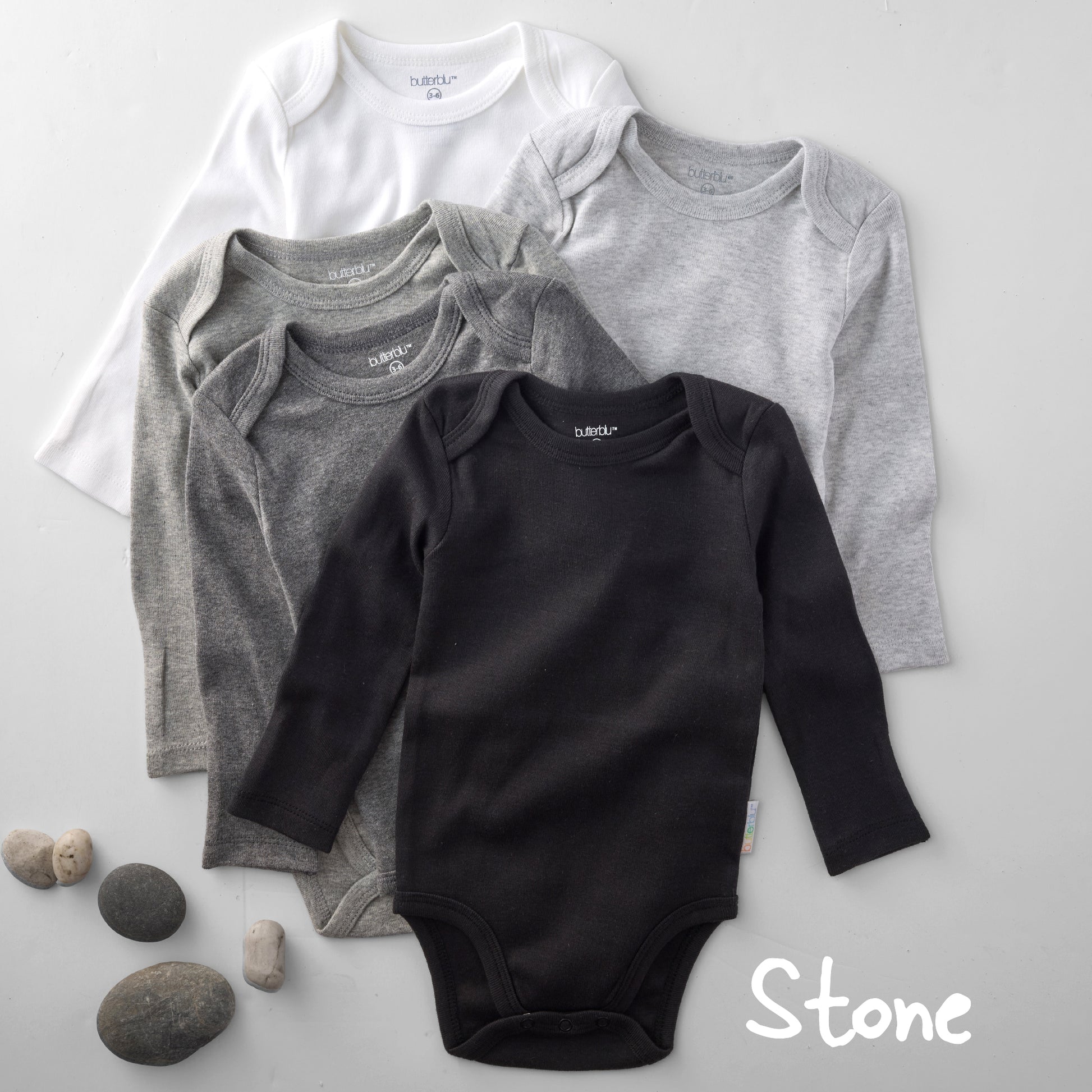 Four baby bodysuits in white, gray, and black on a light gray background with 'Stone' text.