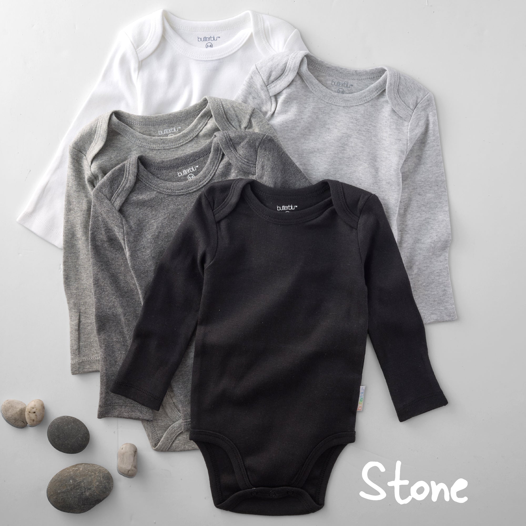 Four baby bodysuits in white, gray, and black on a light gray background with 'Stone' text.