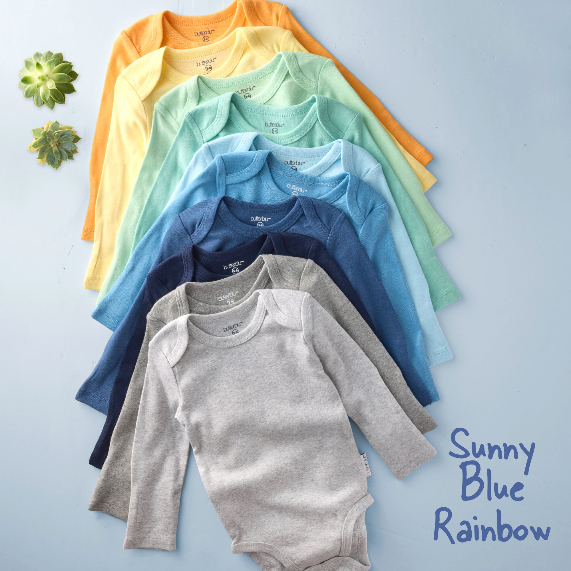 Five baby onesies in blue, gray, and navy on a light blue background with 'Blue' text.