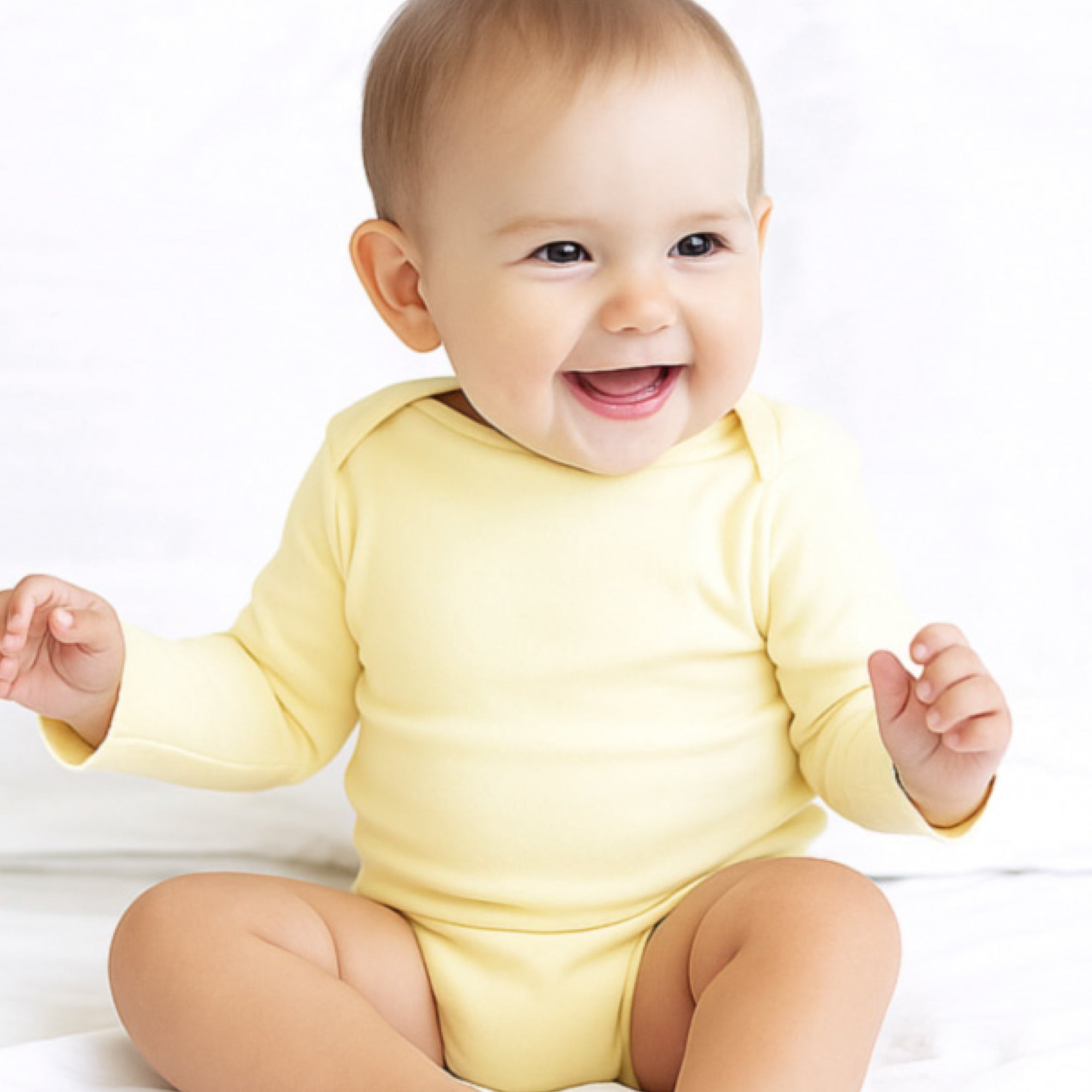 Baby in yellow bodysuits