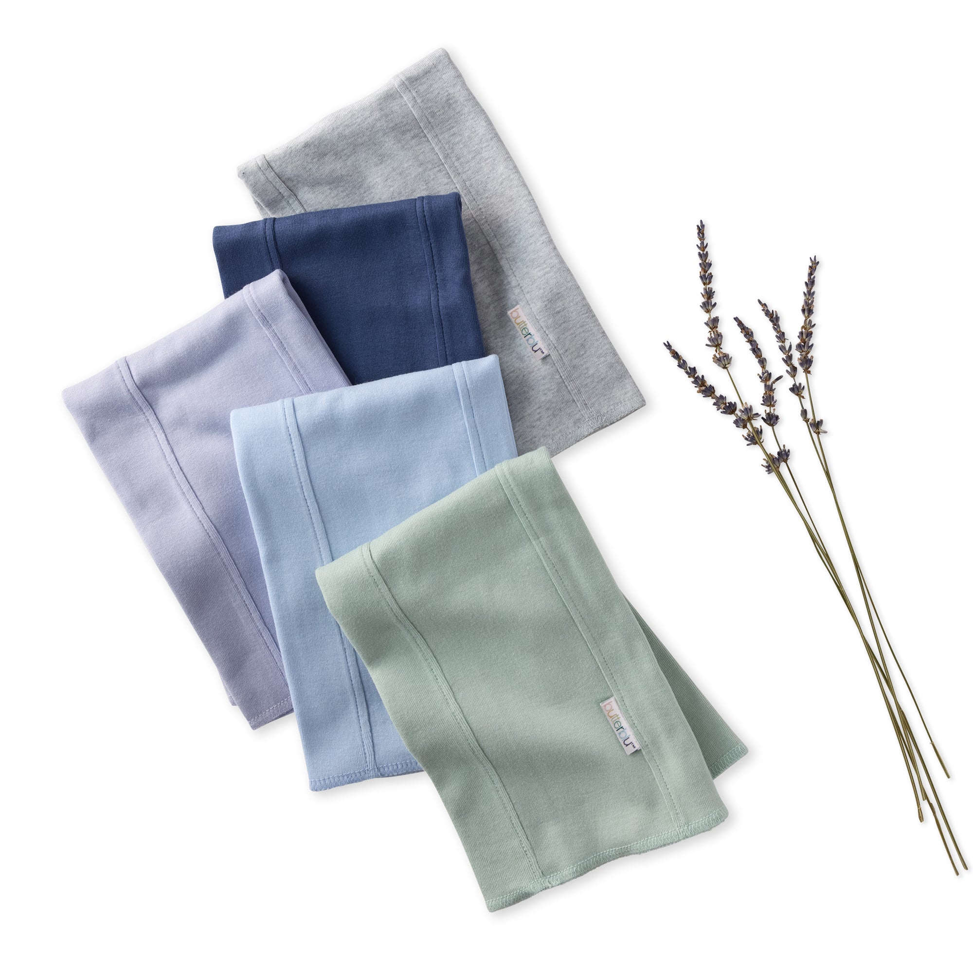 Set of folded BAILEY Burp Cloths in various colors with a bundle of lavender on a white background
