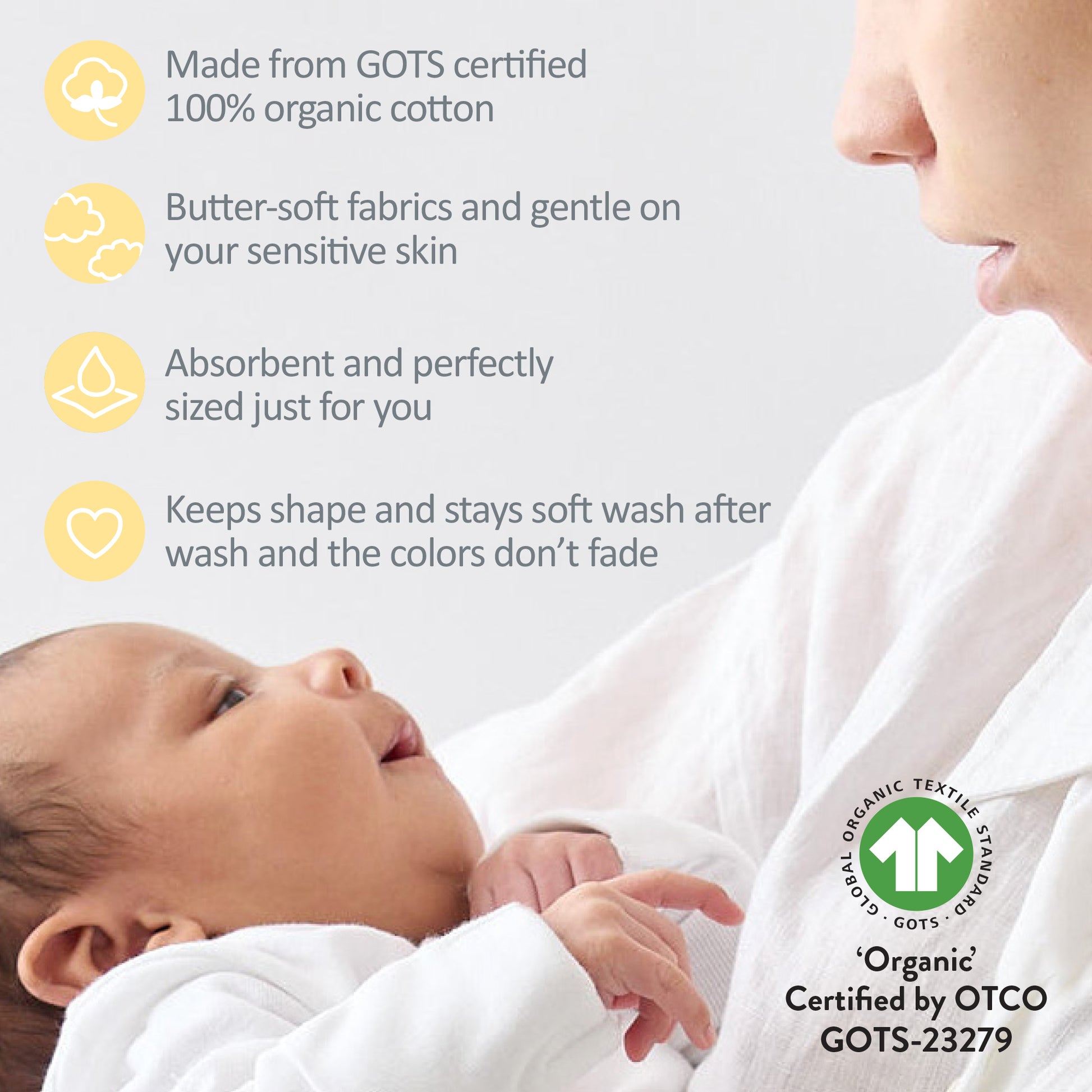 Baby wrapped in white fabric with text about organic cotton and a GOTS certification logo.