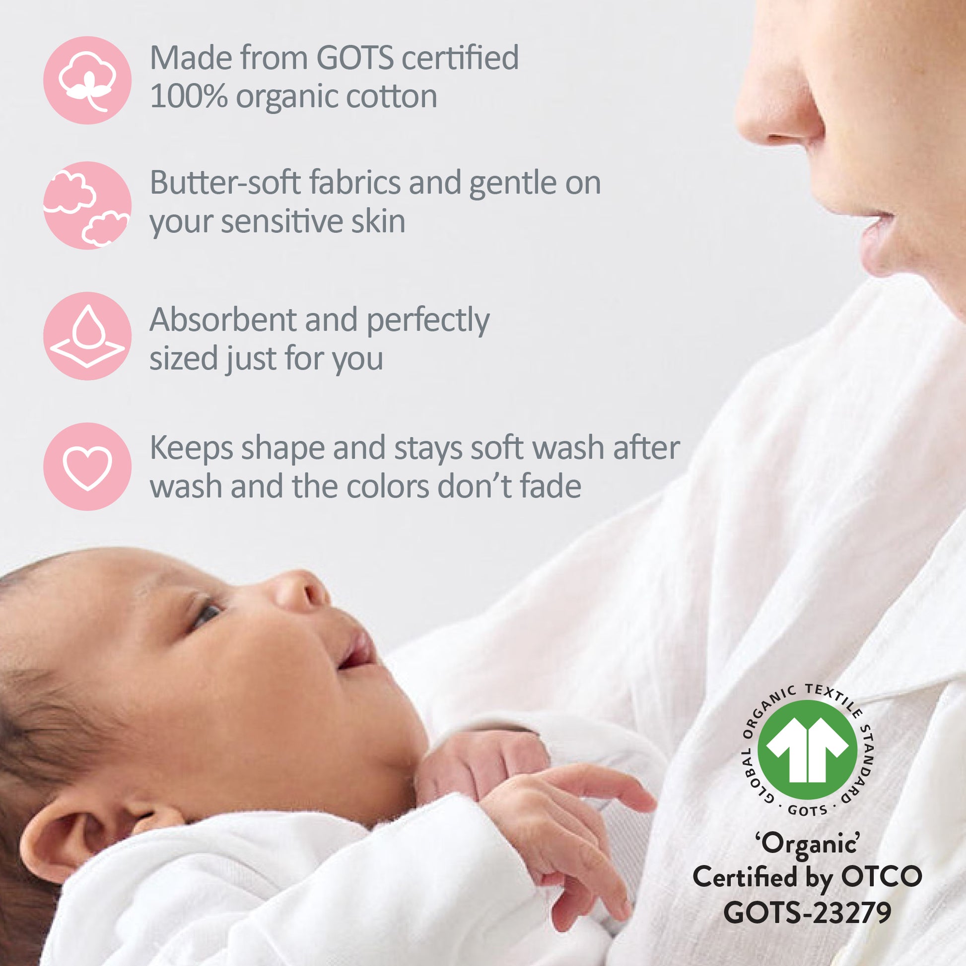 Baby wrapped in organic cotton fabric with GOTS certification label