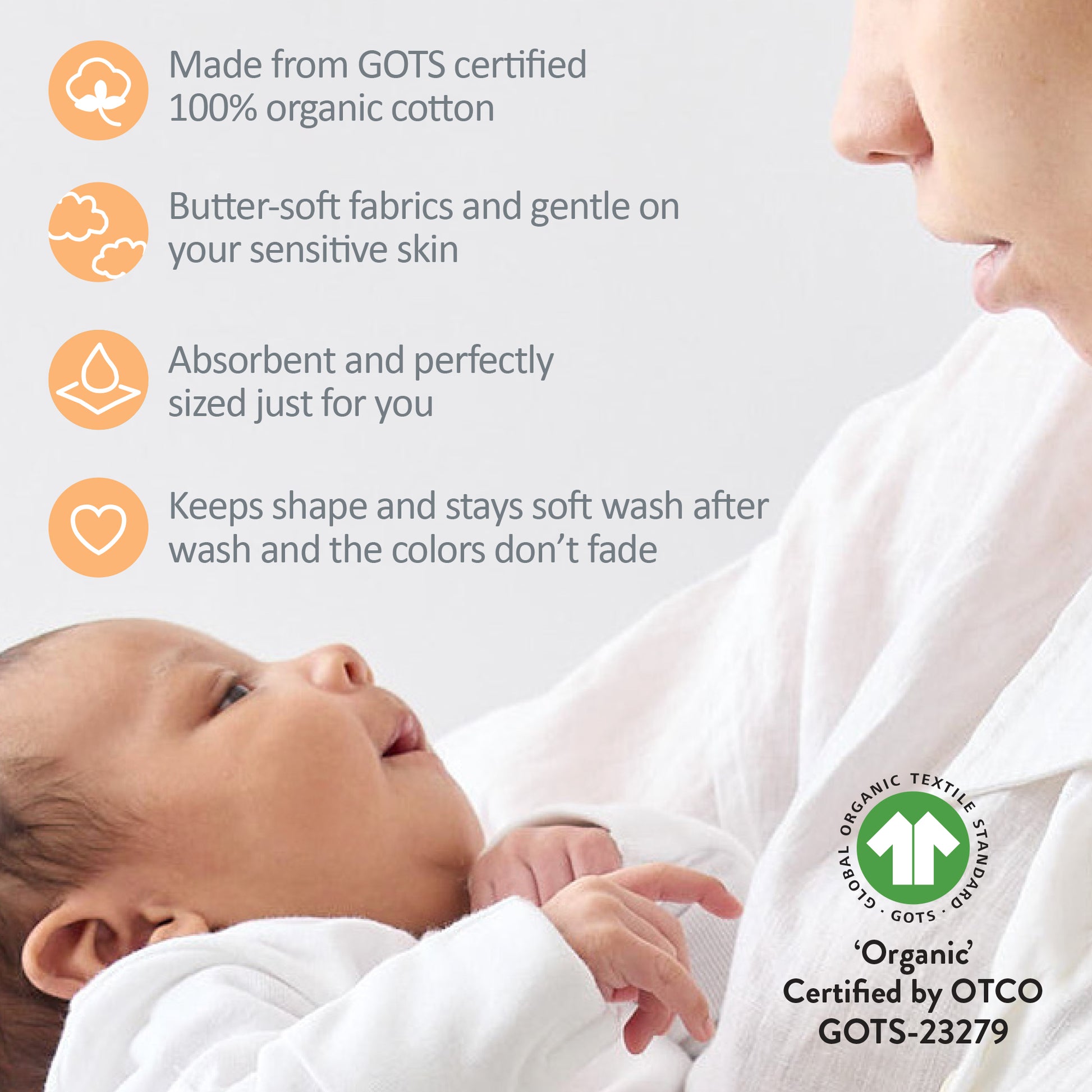 Baby wrapped in organic cotton fabric with GOTS certification label