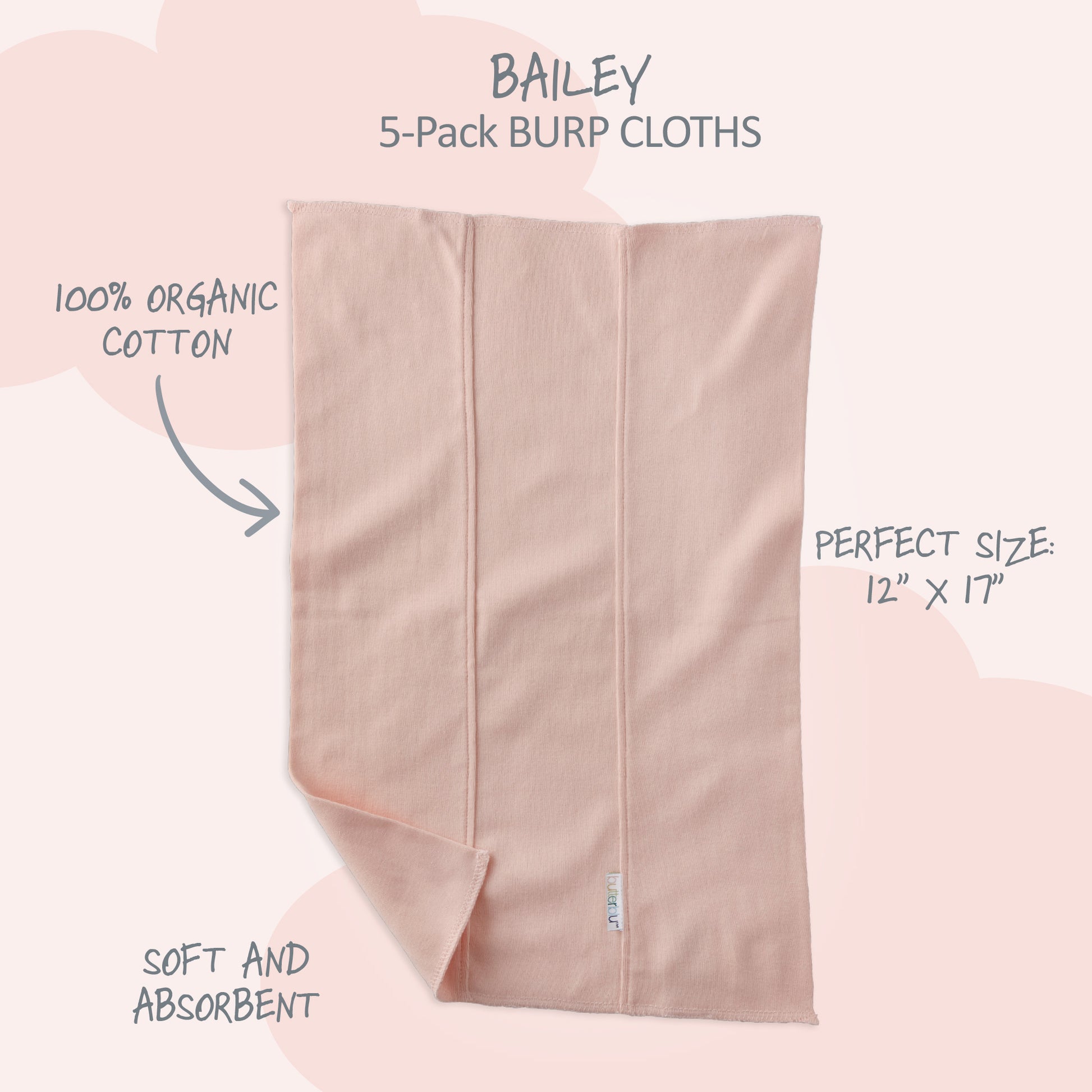 Pink burp cloth with text highlighting features on a pink background