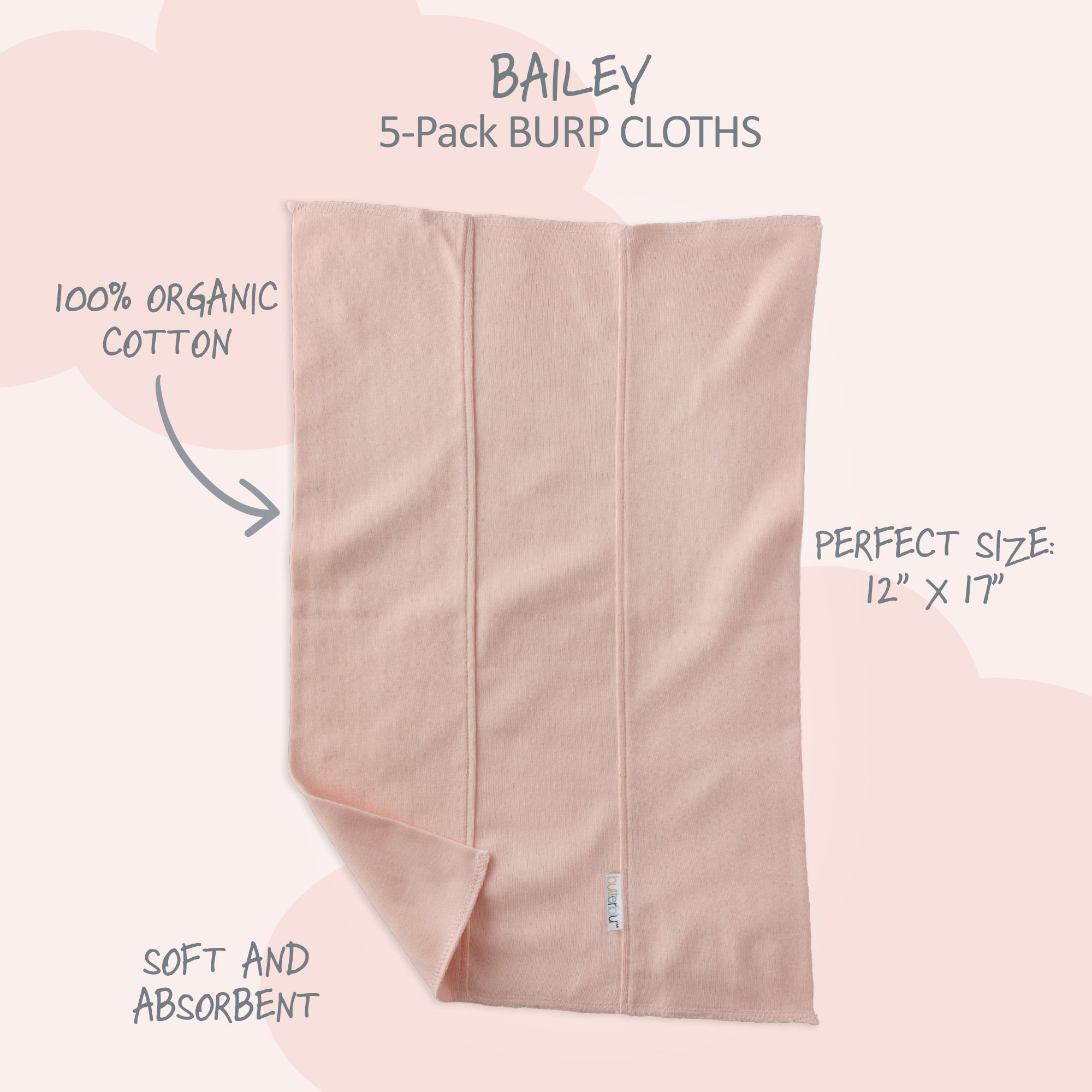Pink burp cloth with text highlighting features on a pink background