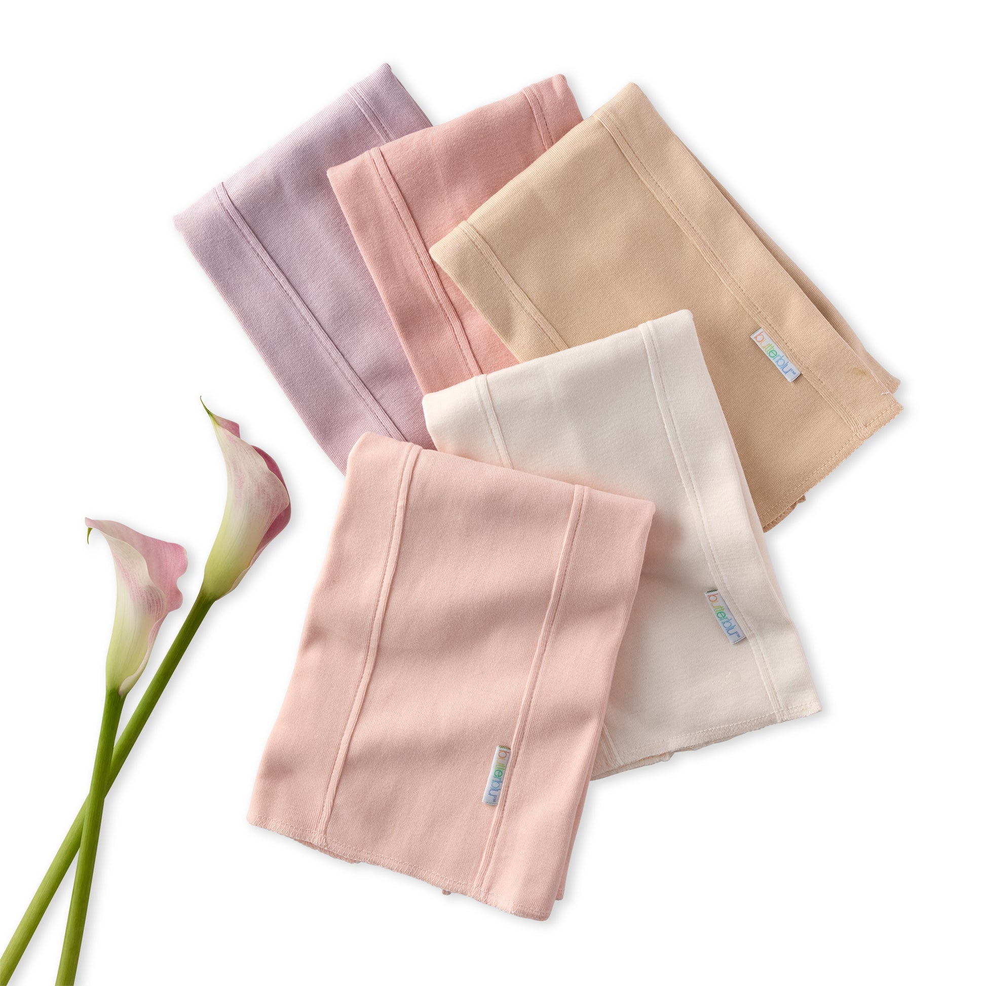Set of folded BAILEY Burp Cloths in pink and beige with a calla lily on a white background