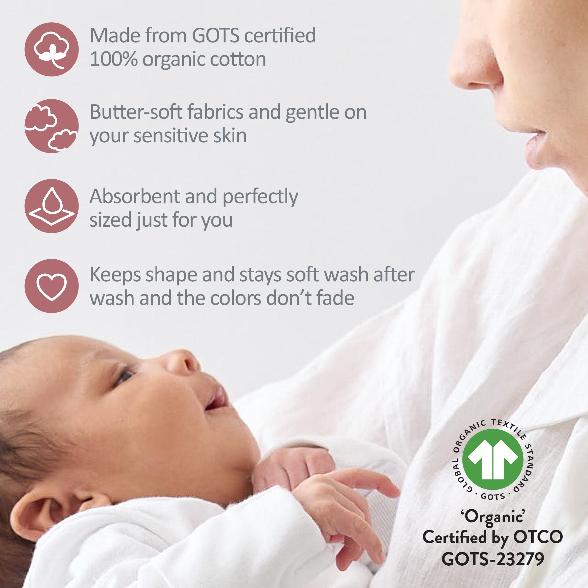 Baby wrapped in white fabric with GOTS certification label, close-up of baby and adult, text about fabric properties.