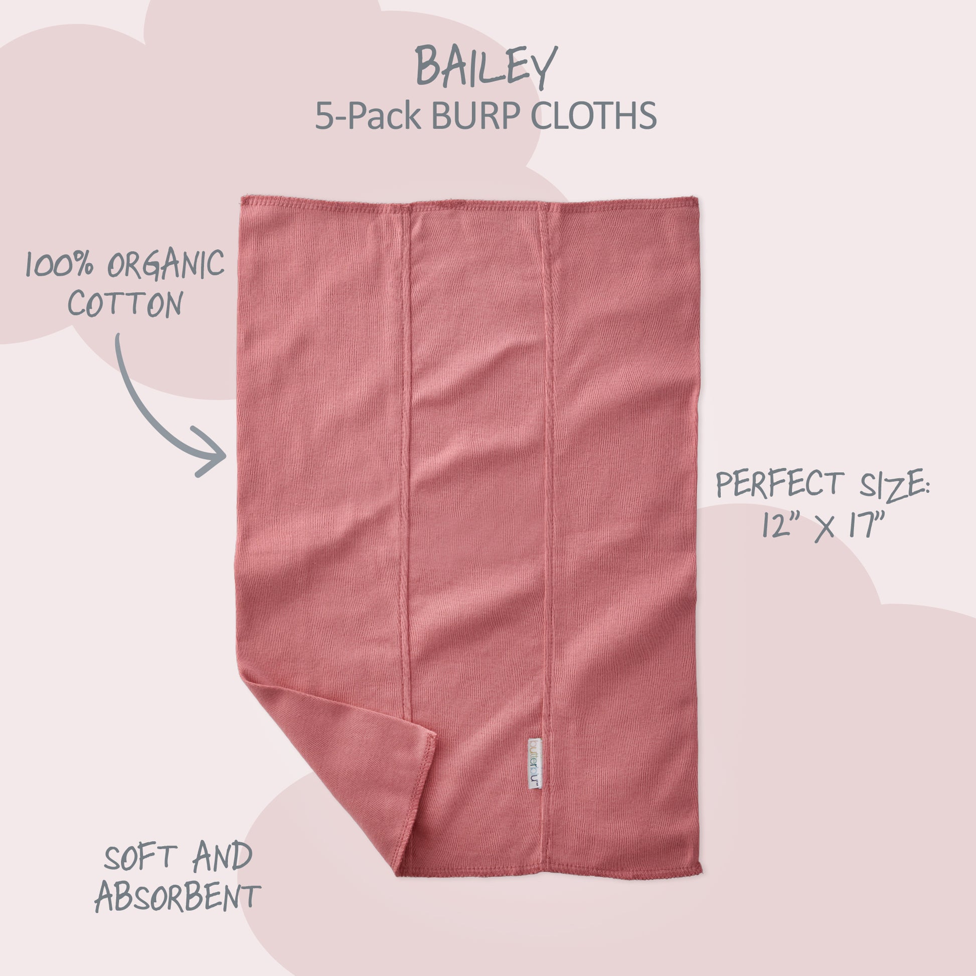 Pink burp cloth with product details on a light pink background