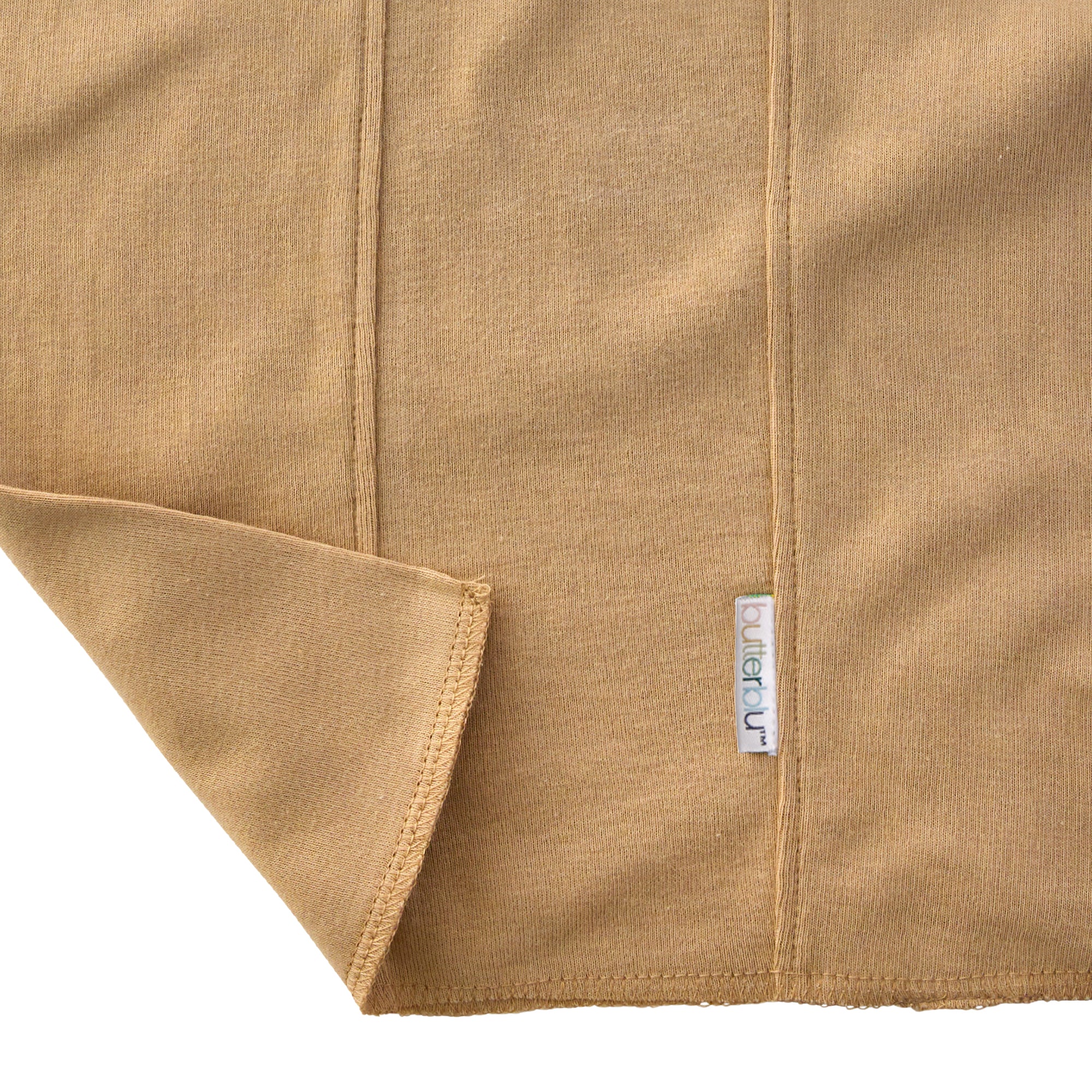 Close-up of a brown fabric with a brand label on a white background