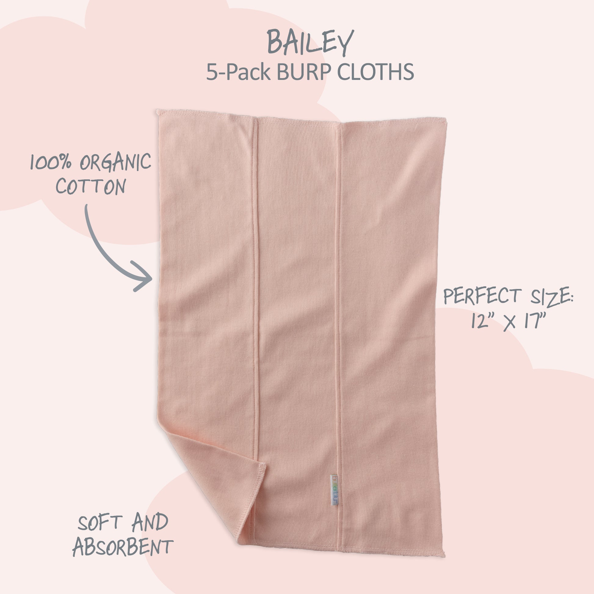 Pink burp cloth with text highlighting features on a light pink background