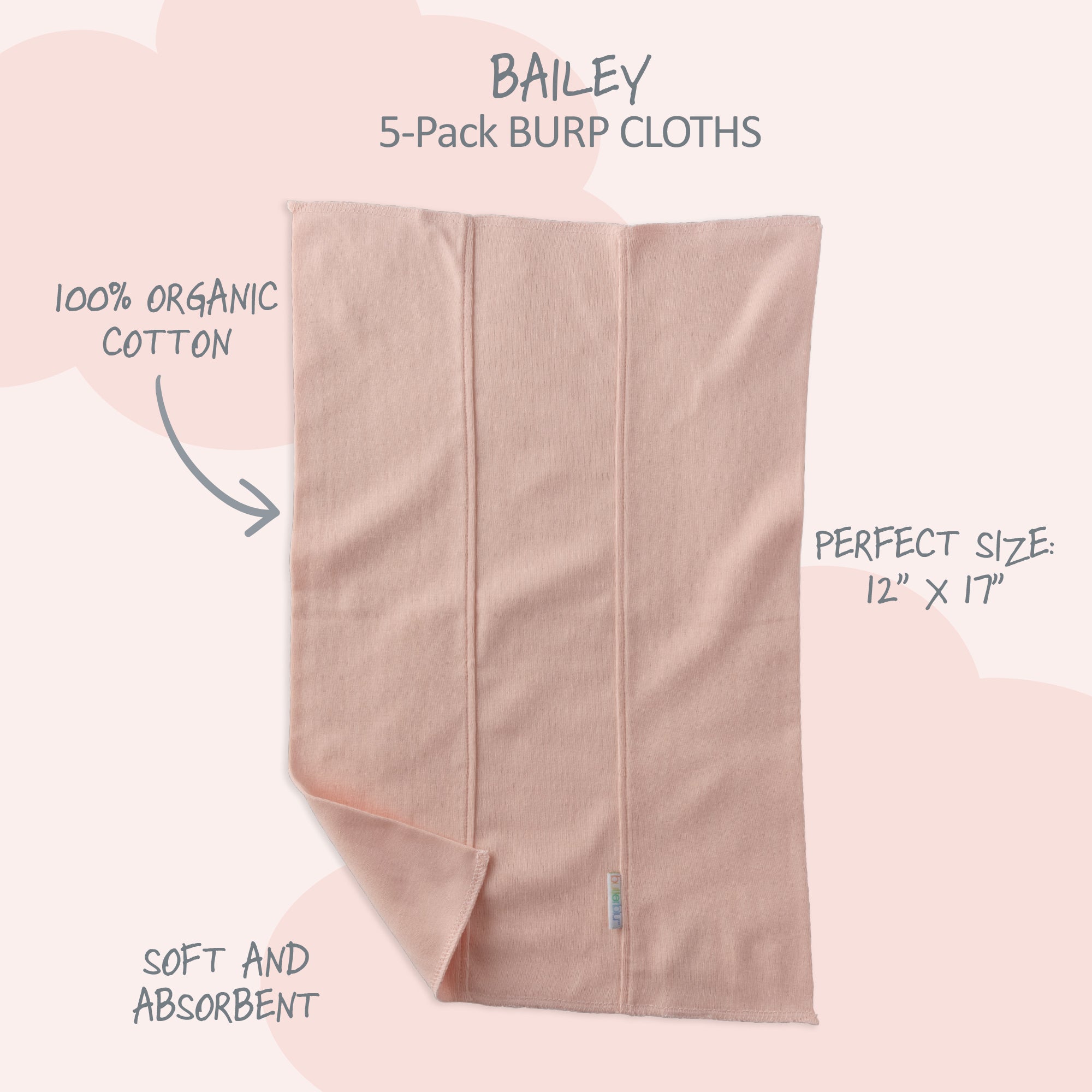 Pink burp cloth with text highlighting features on a light pink background