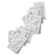 Set of white pillows with visible brand logo on a white background
