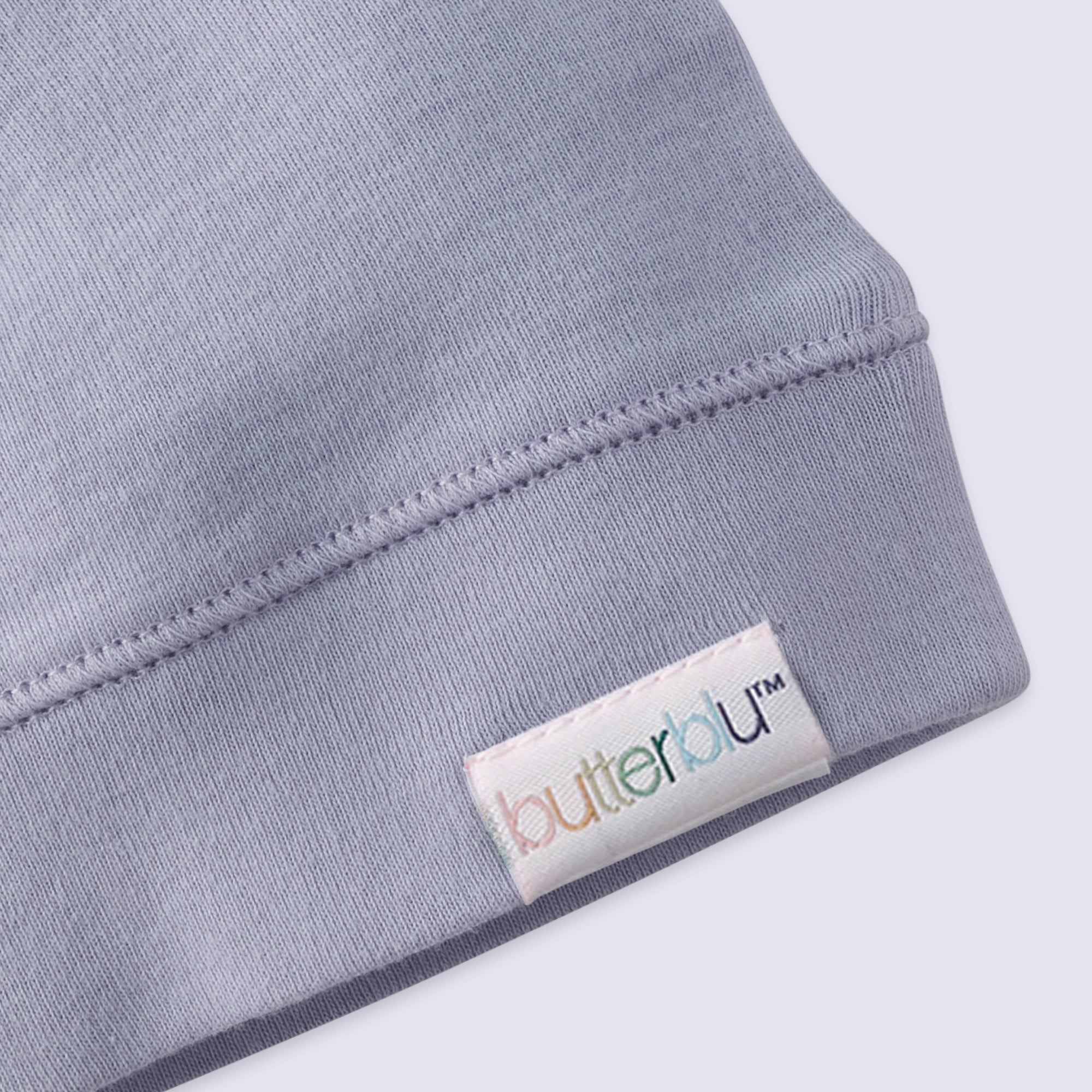 Gray fabric with a 'butterblu' label on a white background