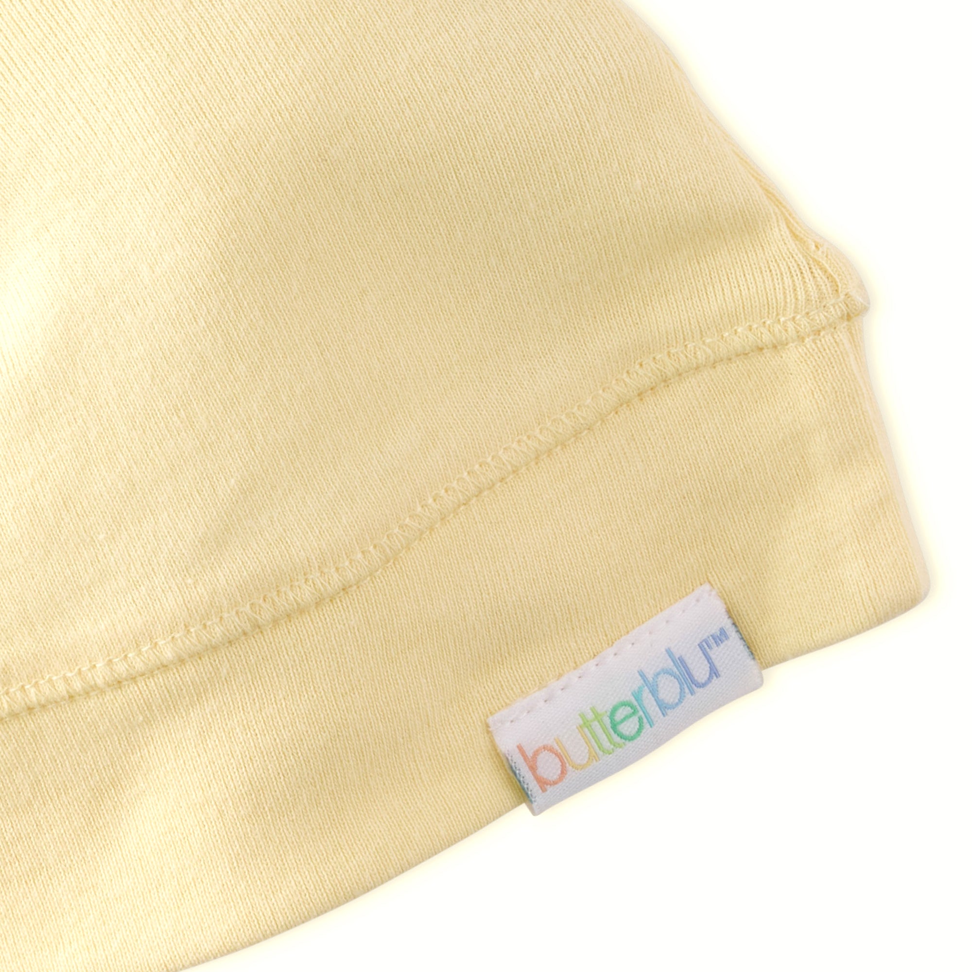 Beige fabric with a 'butterblu' label on a white background