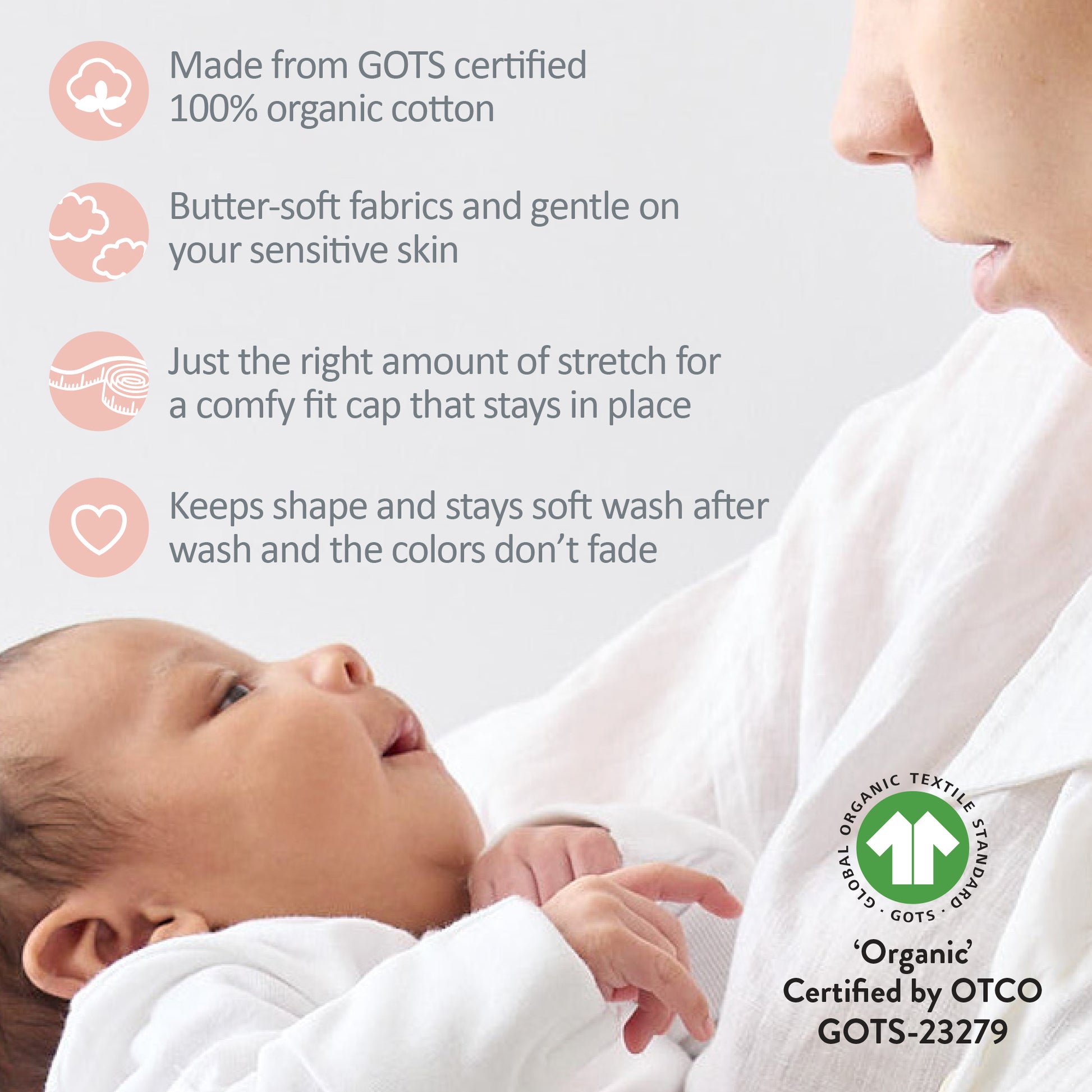 Baby wrapped in white fabric with text about GOTS certified organic cotton and a mother holding the baby.