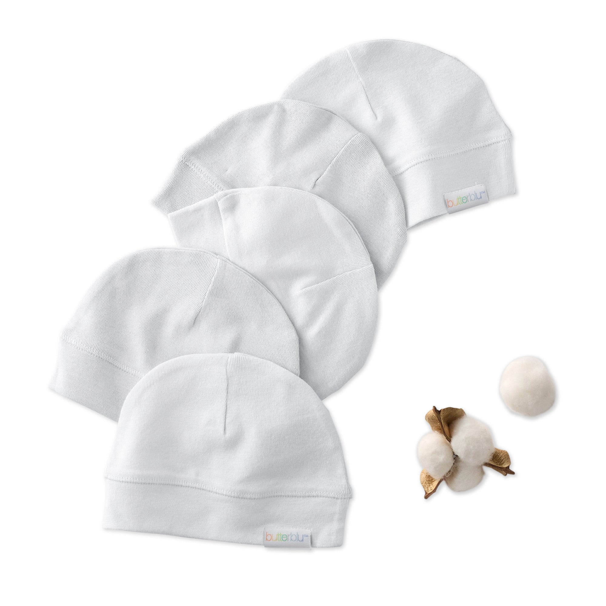 Set of five white baby hats with a cotton boll on a white background