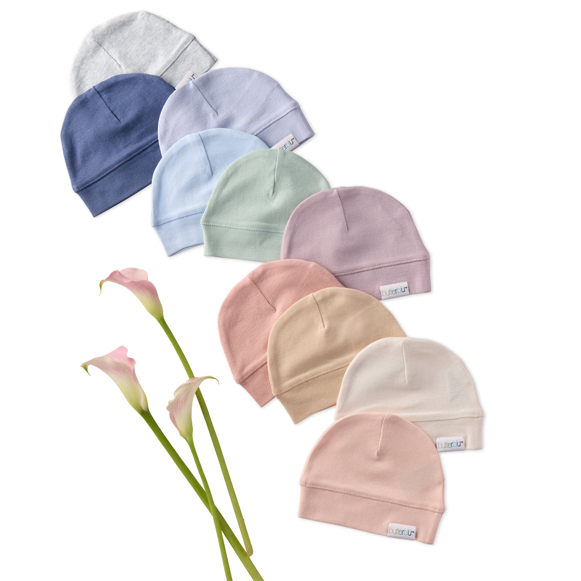 Set of pastel-colored baby hats arranged in a circular pattern with flowers on a white background.