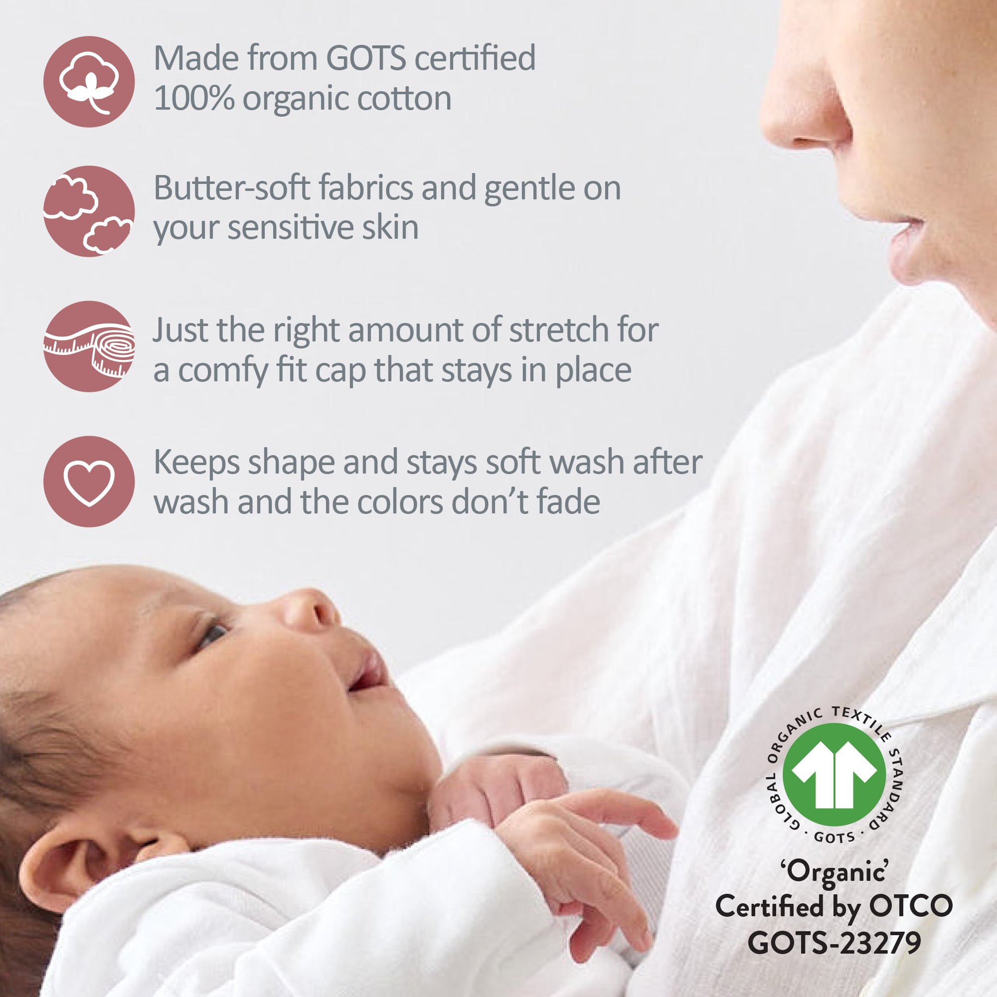 Baby wearing organic cotton clothing with a mother holding the baby, featuring GOTS certification.