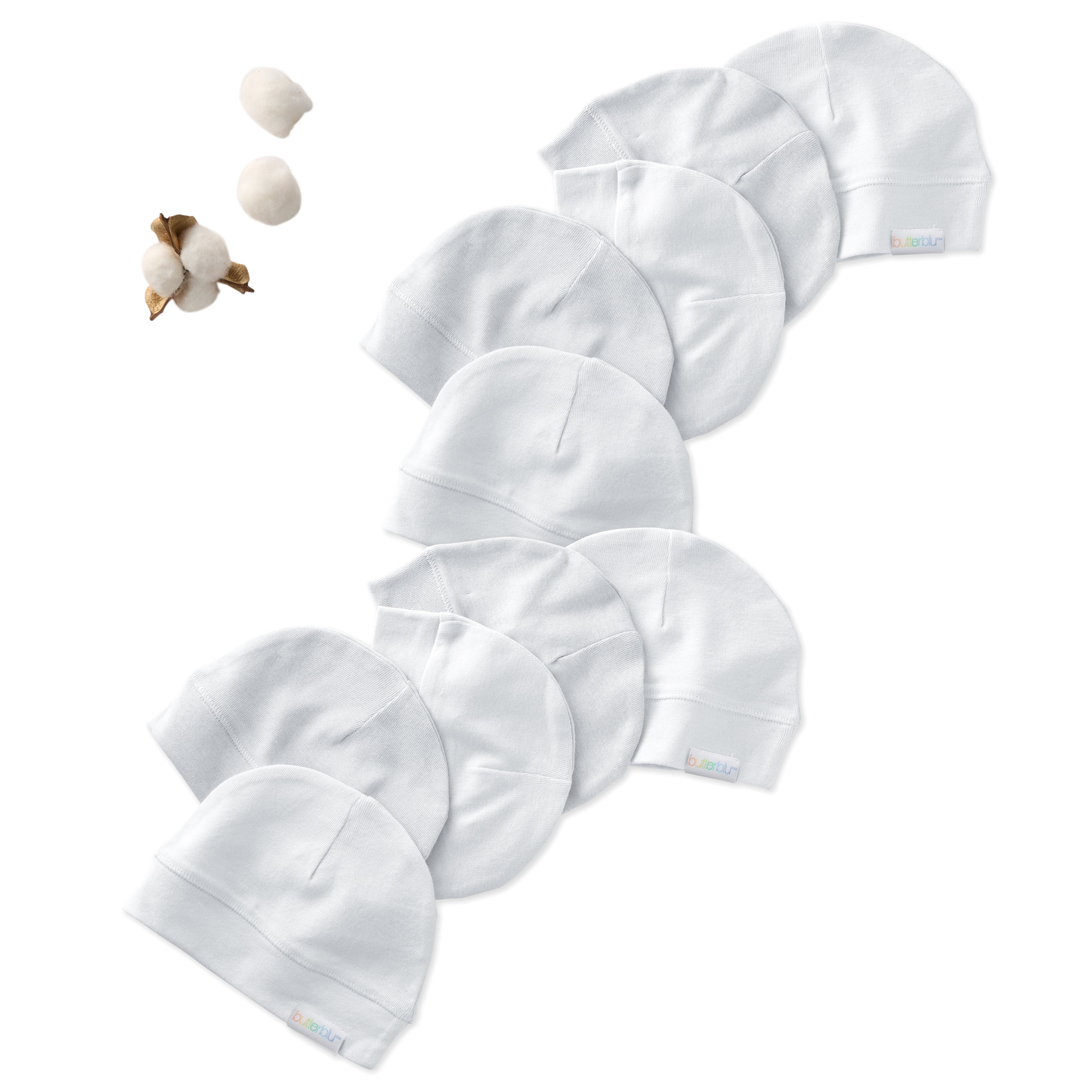 Set of white baby hats on a white background