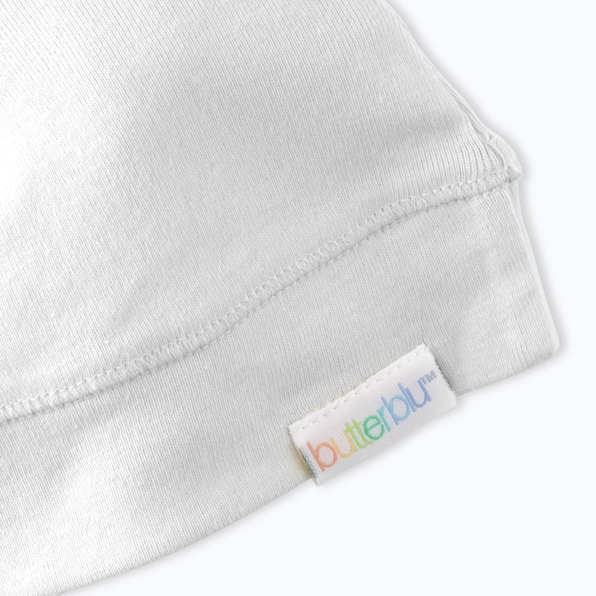 Close-up of a gray fabric with a 'butterblu' label on a white background