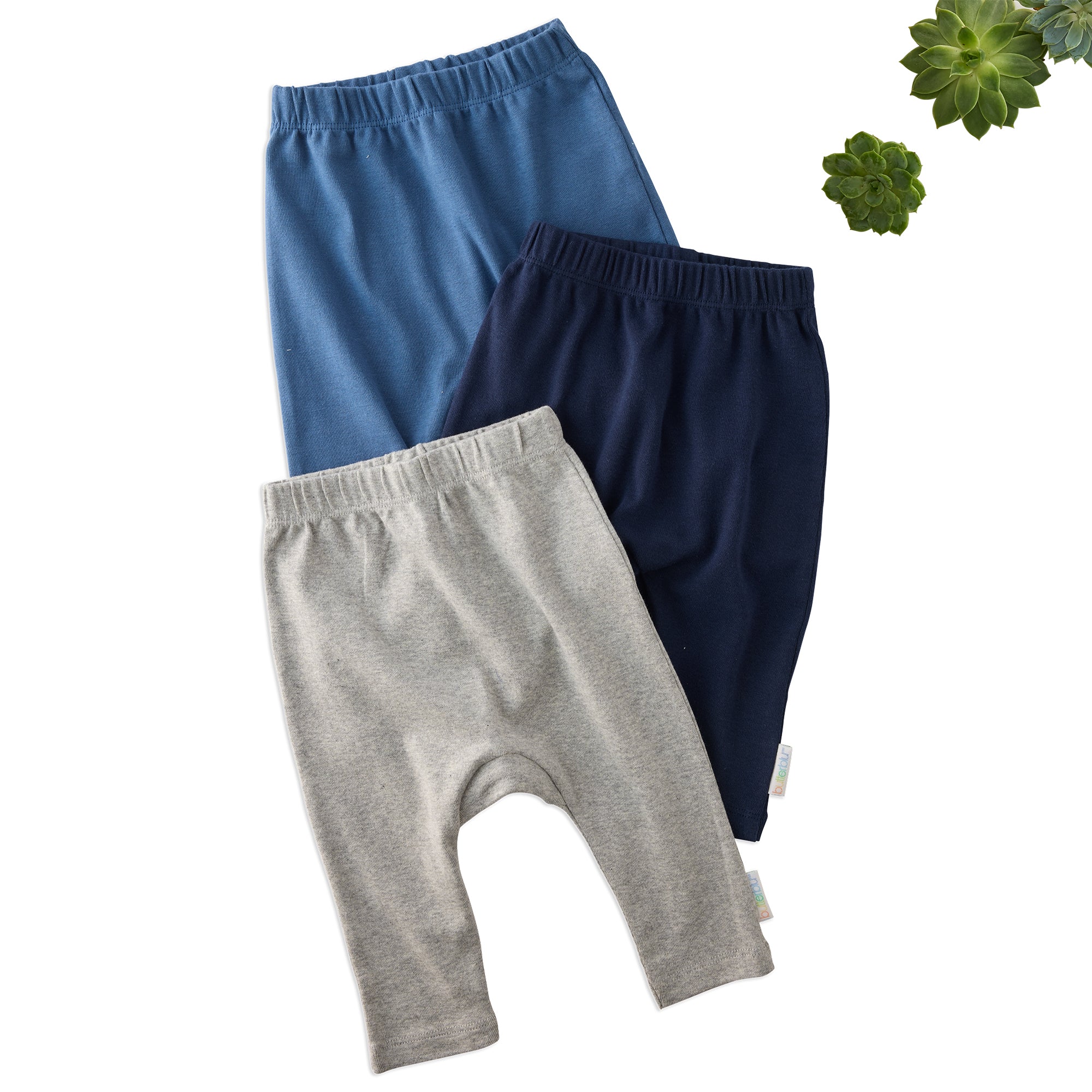 Layout of 3 pairs of harem pants in Blue on a white background with some cactus details

