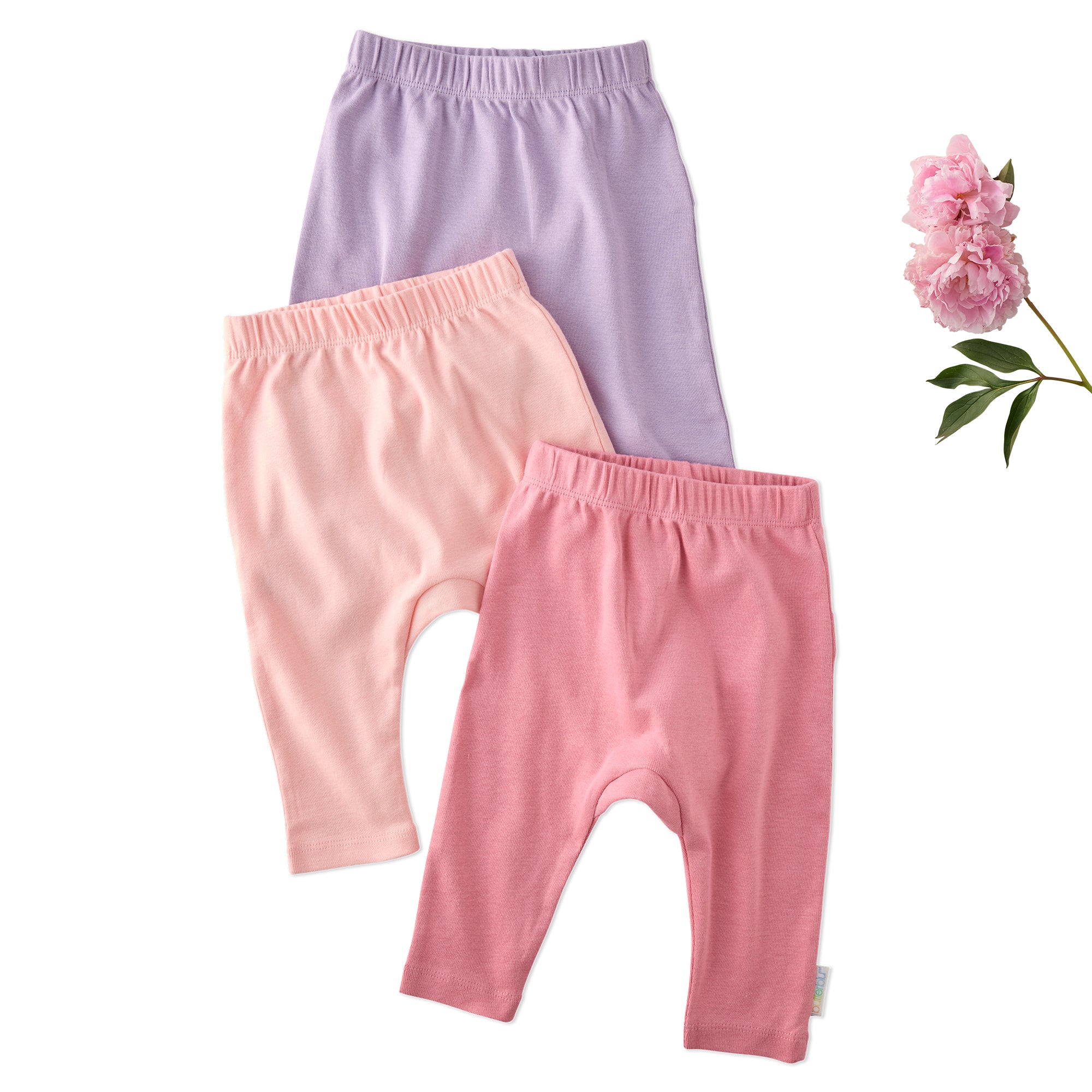 Layout of 3 pairs of harem pants in Pin k on a white background with a rose detail
