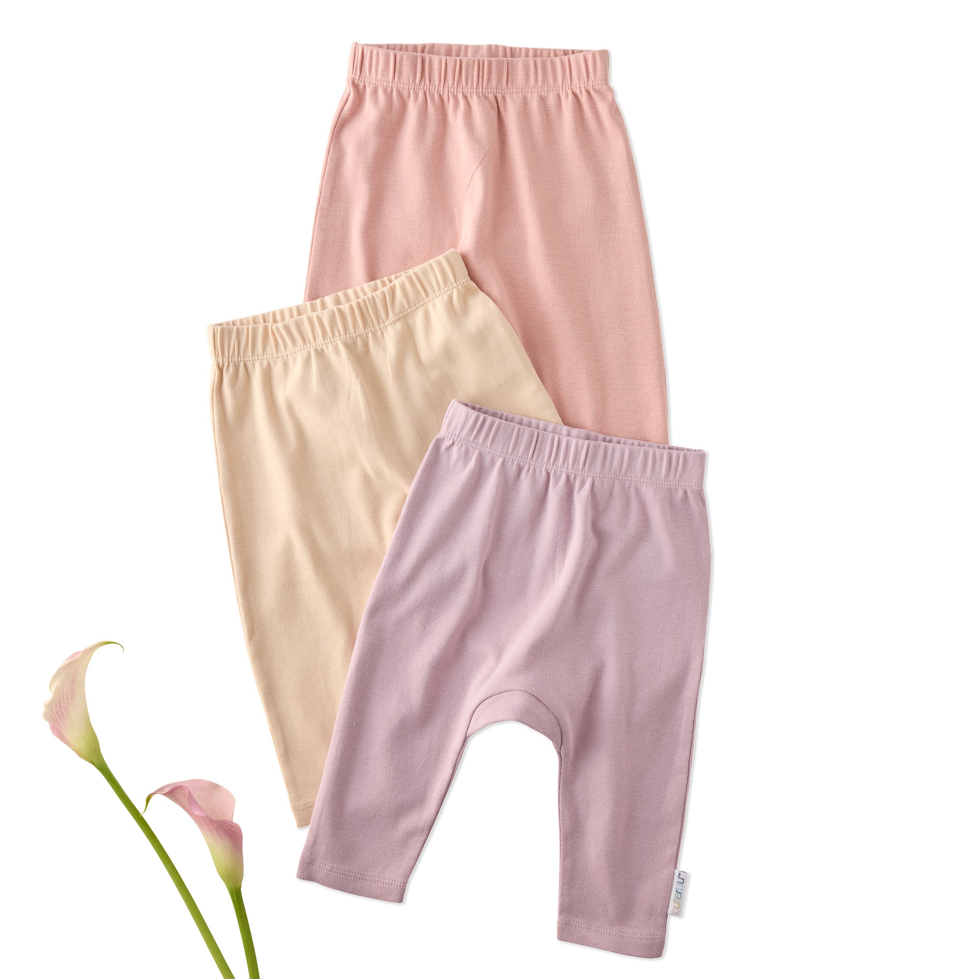 Layout of 3 pairs of harem pants in Sorbet on a white background with a flower detail
