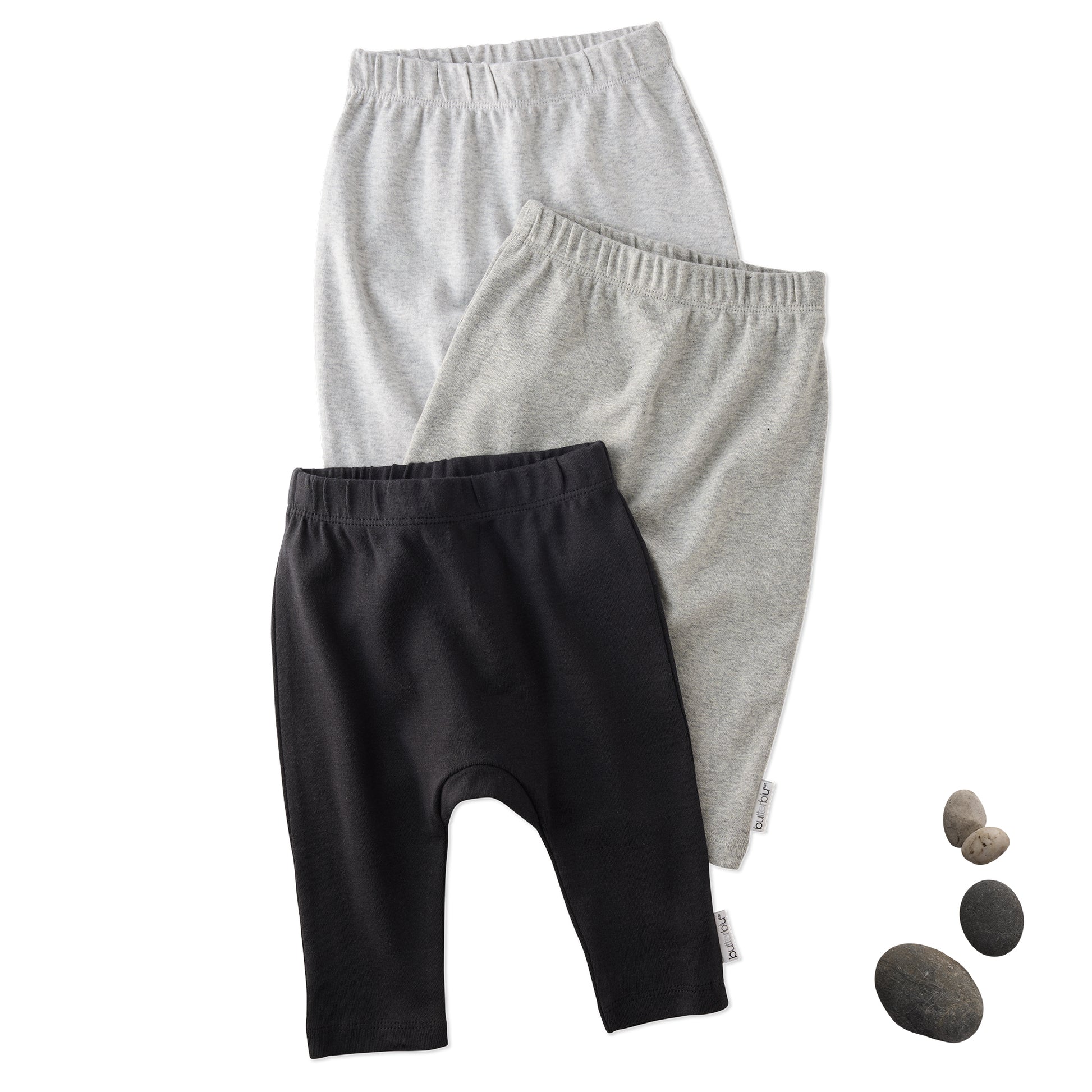 Layout of 3 pairs of harem pants in Stone on a white background with a stone detail
