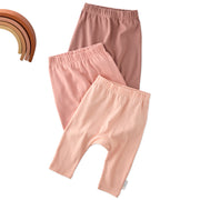 Layout of 3 pairs of harem pants in Sunset on a white background with a rainbow detail
