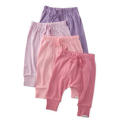 Three pairs of baby pants in pink, purple, and lavender on a white background