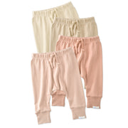 Four pairs of baby pants in beige, pink, and light pink on a white background